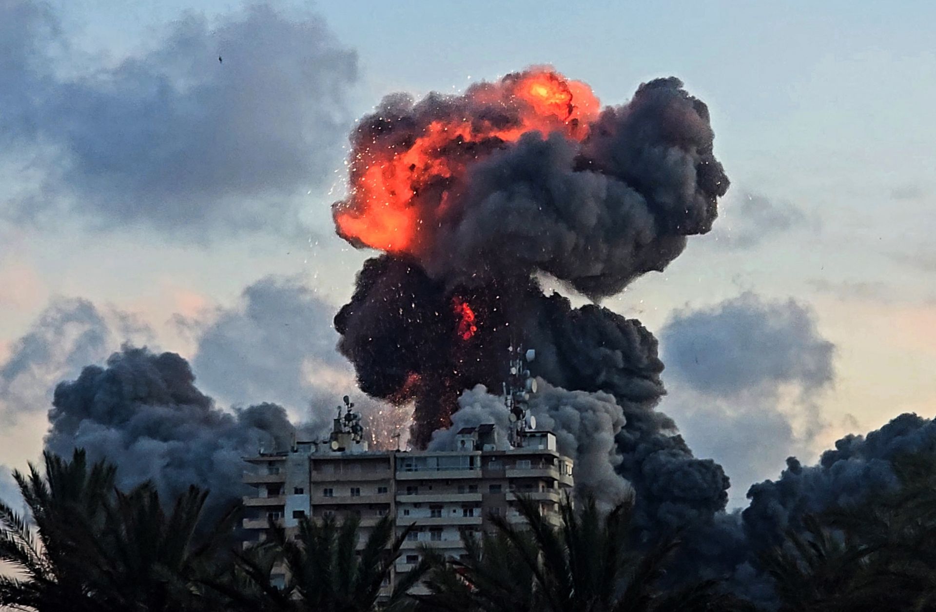 A fireball and smoke erupt from a building following an Israeli strike in Tyre, southern Lebanon, on May 28.