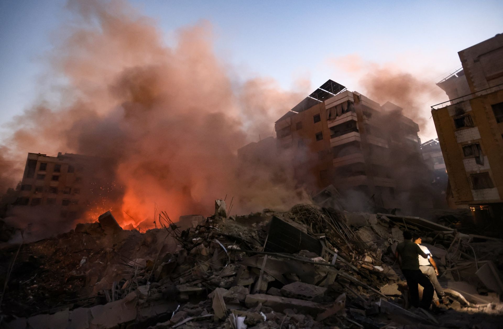 Smoke rises from rubble at the scene of Israeli air strikes in the Haret Hreik neighborhood of Beirut's southern suburbs on Sept. 27, 2024.