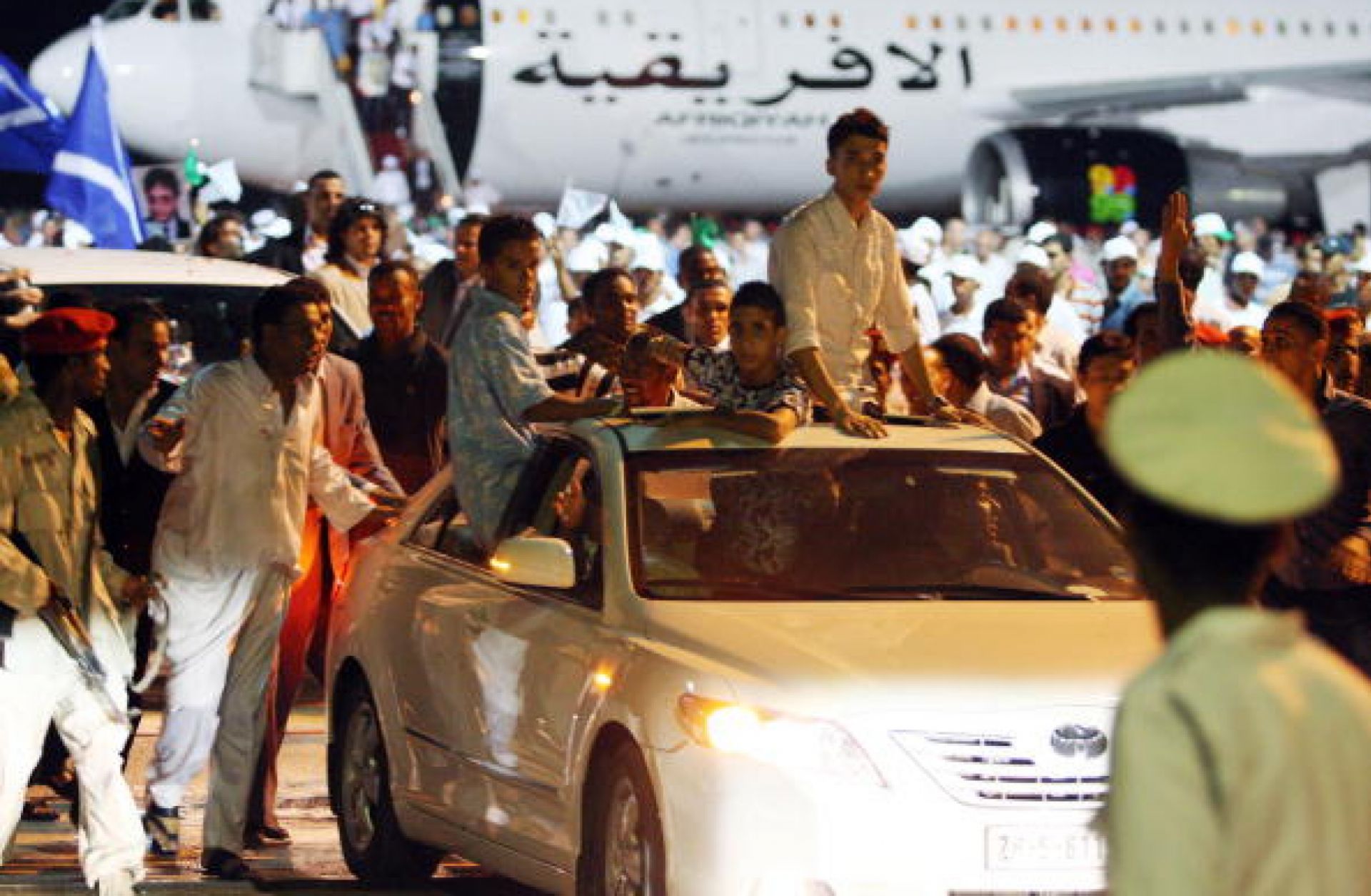 Libyans attend a welcoming ceremony for freed Lockerbie bomber Abdel Basset Ali al-Megrahi (not seen) upon his arrival in Tripoli late on August 20, 2009.
