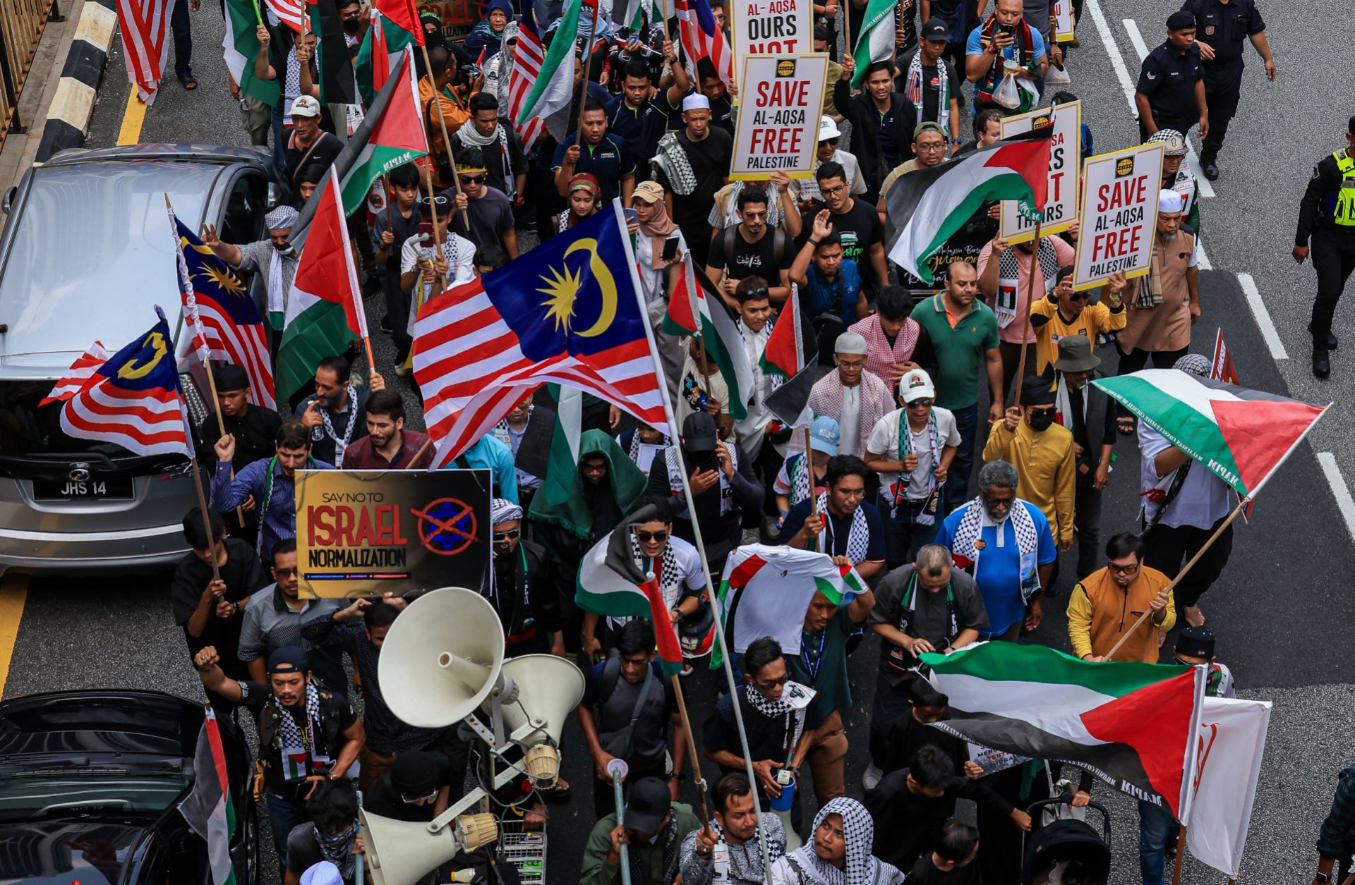 Malaysian Muslim activists and Palestinian nationals gather to express solidarity with the people of Palestine as they march toward the U.S. Embassy in Kuala Lumpur, Malaysia, on Oct. 13, 2023. 