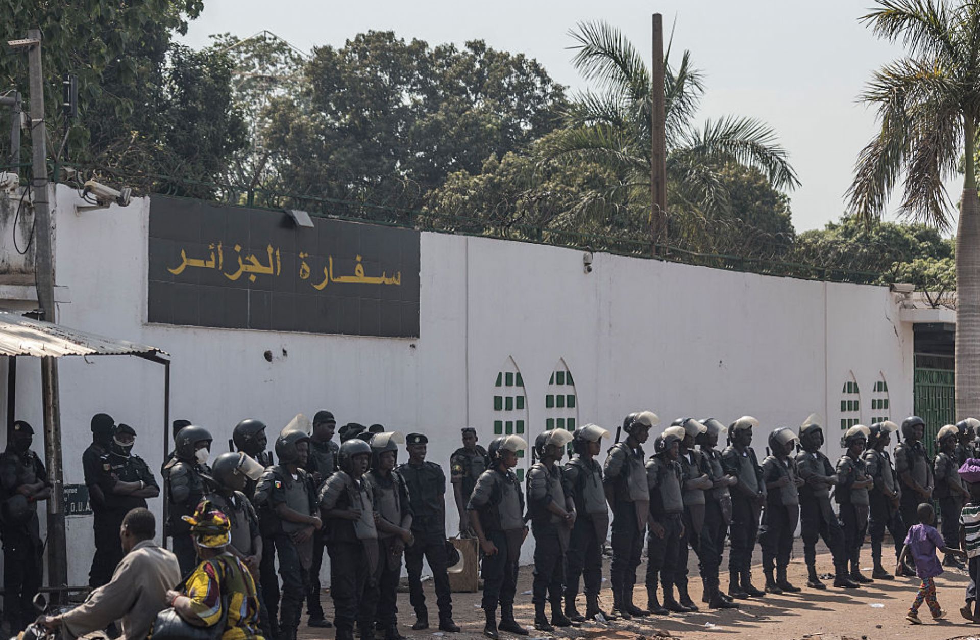 Anti-riot police officers on April 8 in front of the Algerian Embassy in Bamako, Mali.