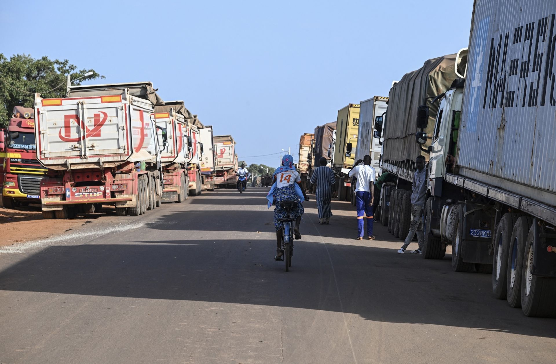 Malian trucks carrying fuel are seen waiting to cross the border between Cote d'Ivoire and Mali on Oct. 31, 2025. Malian trucks carrying fuel are seen waiting to cross the border between Cote d'Ivoire and Mali on Oct. 31, 2025.
