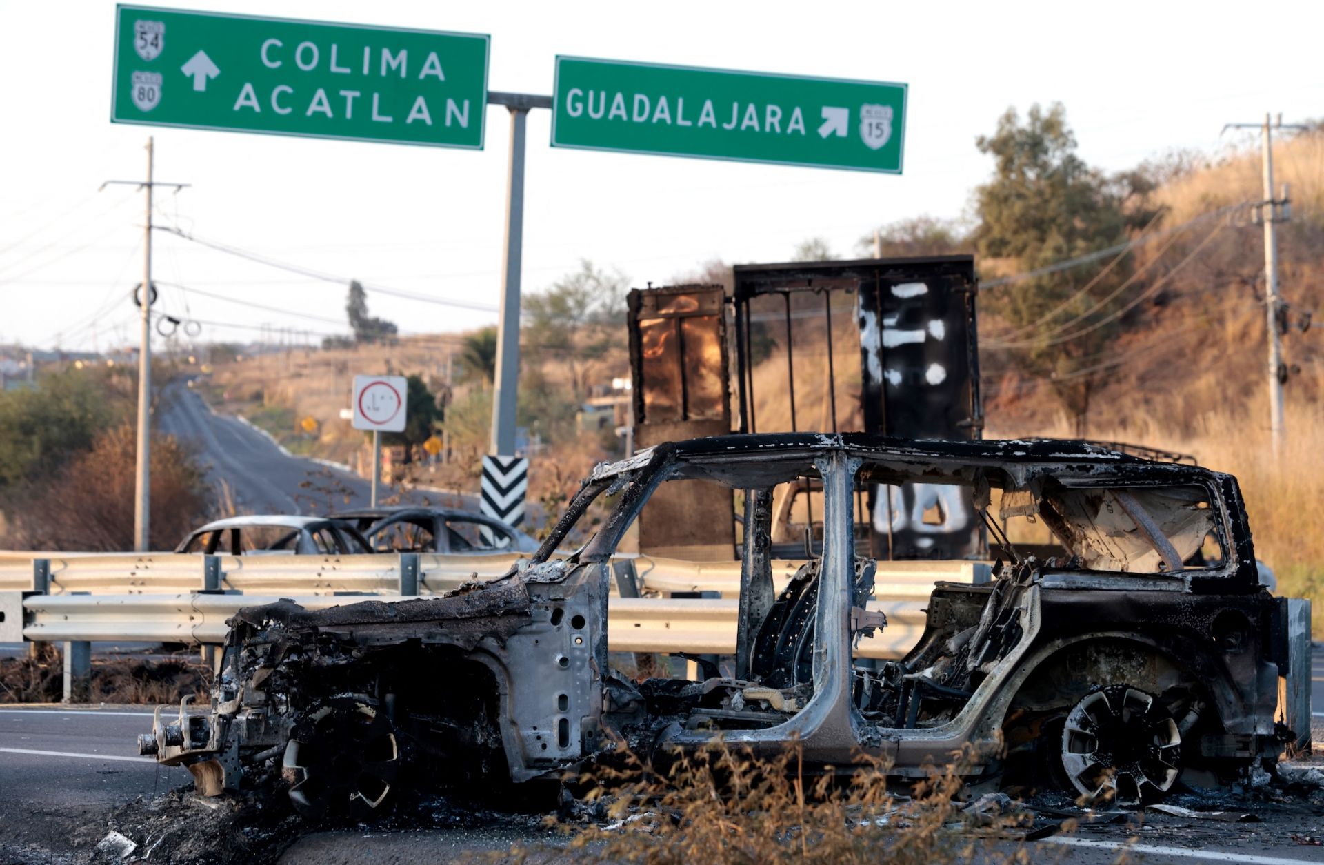 A burned car is seen on a highway near Acatlan de Juarez, Jalisco state, Mexico, on Feb. 22, 2026. The car was allegedly set on fire by organized crime groups in response to the killing of Nemesio Oseguera "El Mencho," the top leader of the Jalisco New Generation Cartel (CJNG). A burned car is seen on a highway near Acatlan de Juarez, Jalisco state, Mexico, on Feb. 22, 2026. The car was allegedly set on fire by organized crime groups in response to the killing of Nemesio Oseguera "El Mencho," the top leader of the Jalisco New Generation Cartel (CJNG).
