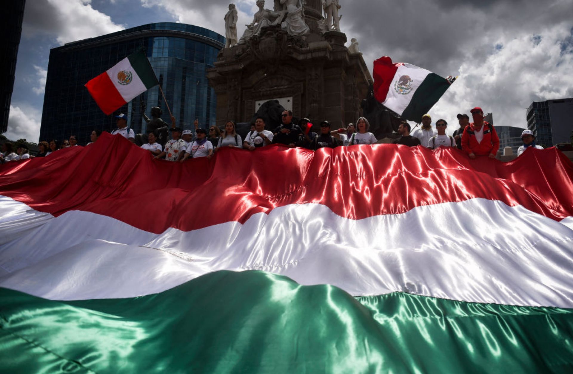 Members of the National Association of Magistrates and District Judges hold a massive Mexican flag during a protest in Mexico City, Mexico, on Sept. 11, 2024, after Mexico's Senate approved controversial judicial reforms. 