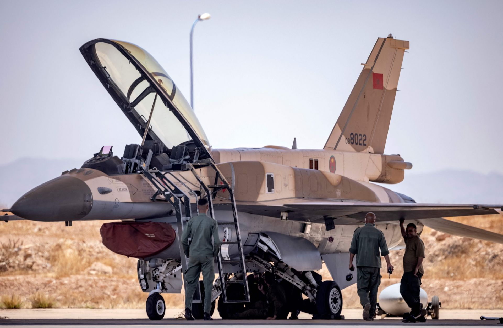 Moroccan Air Force mechanics examine an F-16 fighter jet at an airbase in Ben Guerir, about 58 kilometers north of Marrakesh, Morocco, on June 14, 2021. 