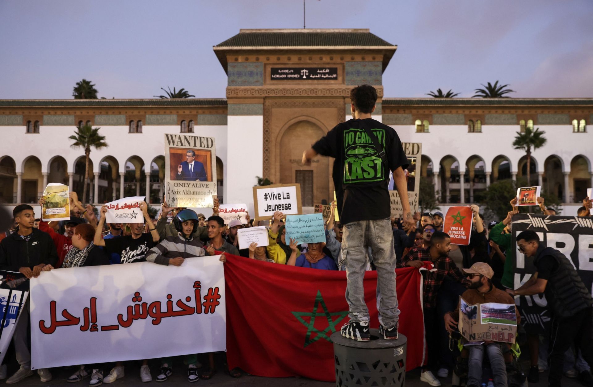 Demonstrators lift banners during a youth-led protest demanding reforms to public healthcare and education in Casablanca, Morocco, on Oct. 6, 2025.
