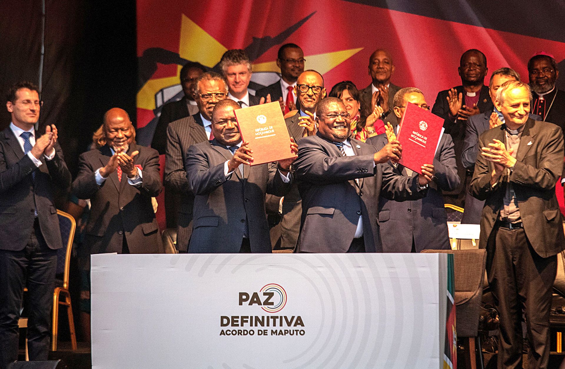 Mozambican President Filipe Nyusi (left) and Mozambican National Resistance leader Ossufo Momade display the cease-fire agreement they signed in Maputo on Aug. 6, 2019.