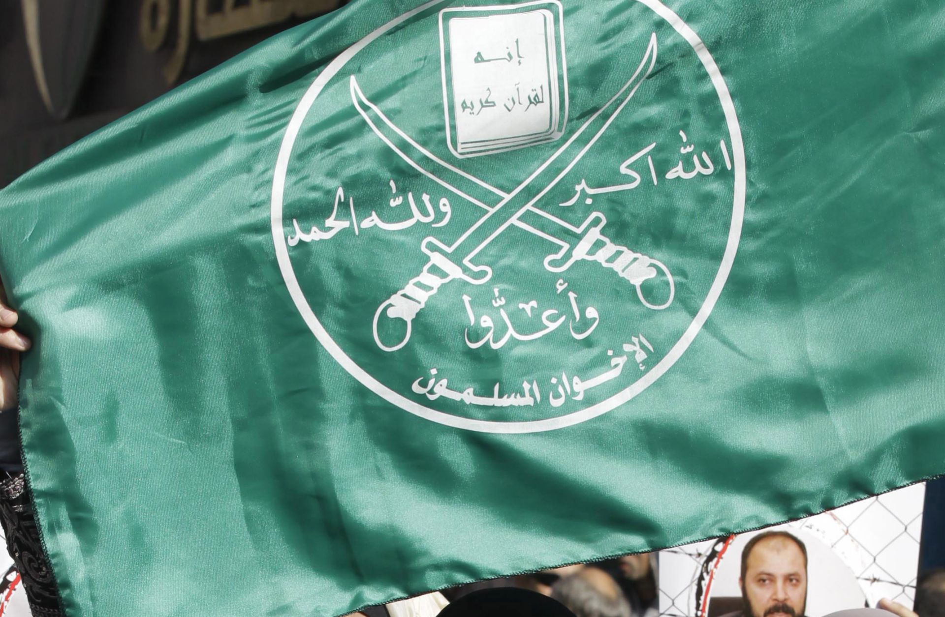Supporters of the Muslim Brotherhood in Jordan hold the movement's flag during a demonstration in the capital, Amman, on Nov. 28, 2014. Supporters of the Muslim Brotherhood in Jordan hold the movement's flag during a demonstration in the capital, Amman, on Nov. 28, 2014.
