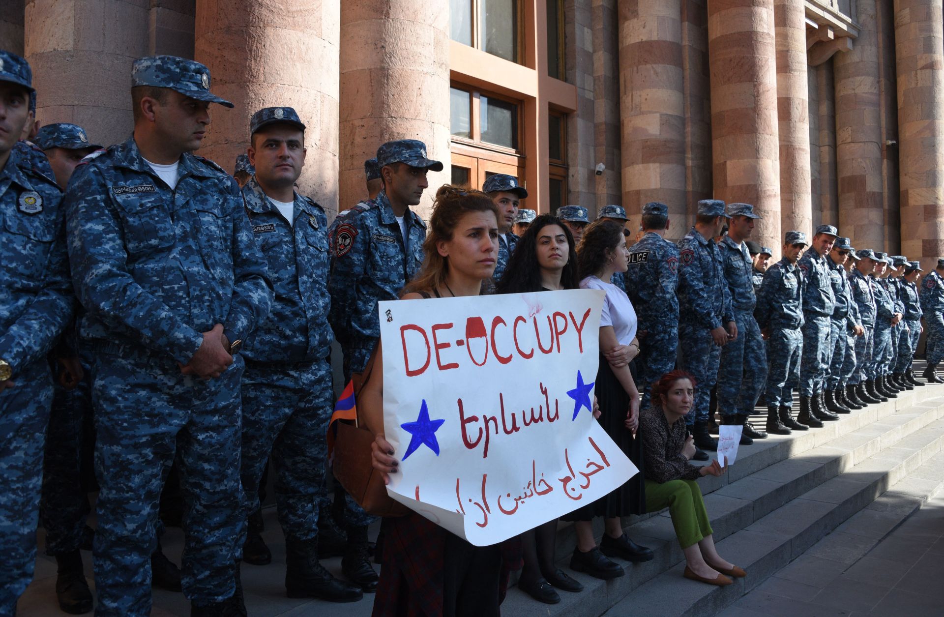 Armenians protest outside the government building in central Yerevan to urge the government to respond to the Azerbaijani military operation launched against the breakaway Nagorno-Karabakh region on Sept. 19, 2023.