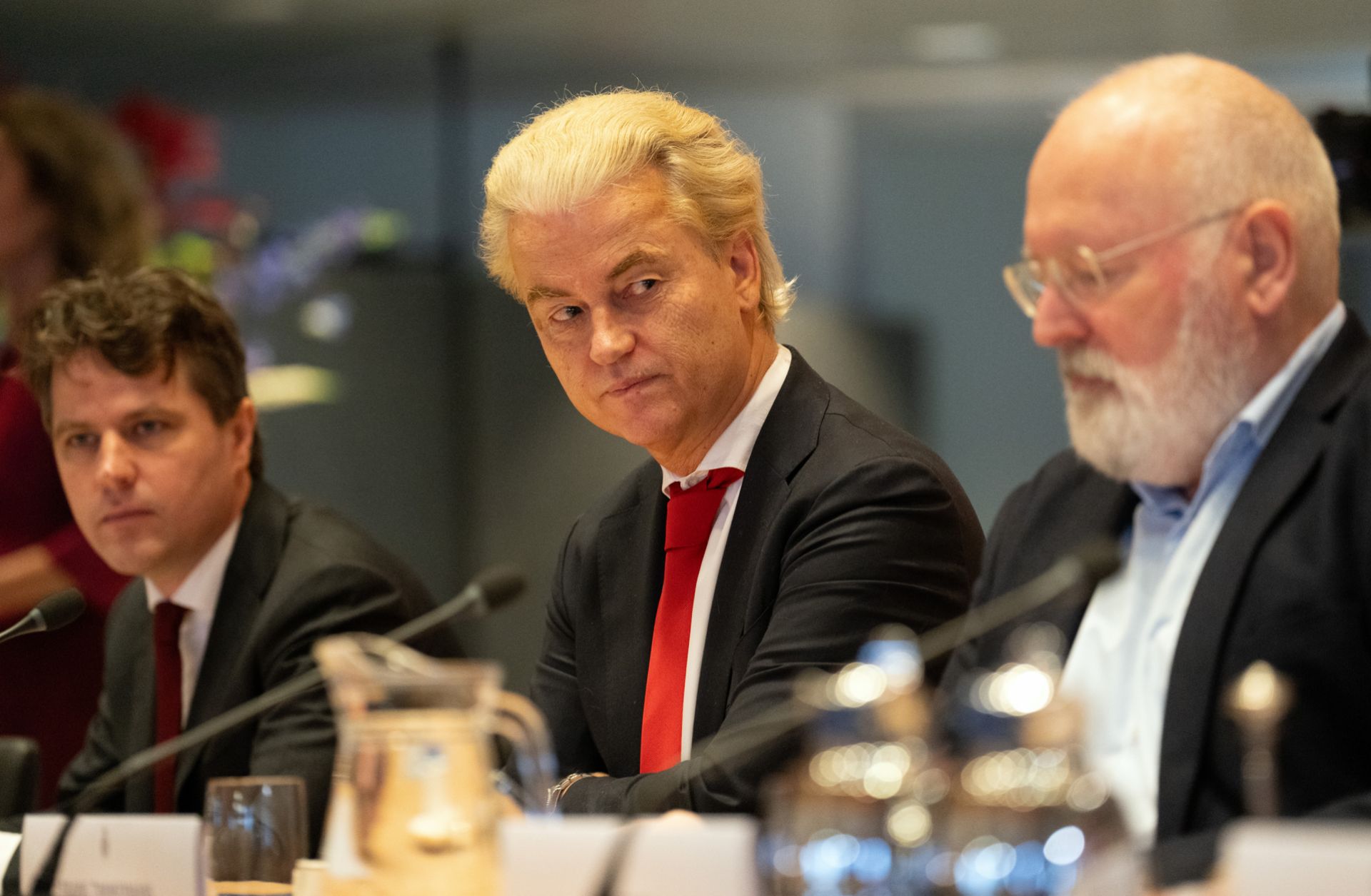 Geert Wilders (C), leader of the far-right Party for Freedom, sits next to Frans Timmermans (R), leader of the Green Left-Labor Party alliance, and Henri Bontenbal (L), leader of the Christian Democratic Appeal party, during a meeting in the Dutch parliament on Nov. 24, 2023, in The Hague, Netherlands. The party leaders are discussing the formation of a coalition government following Wilders' victory in the Nov. 22 general election.