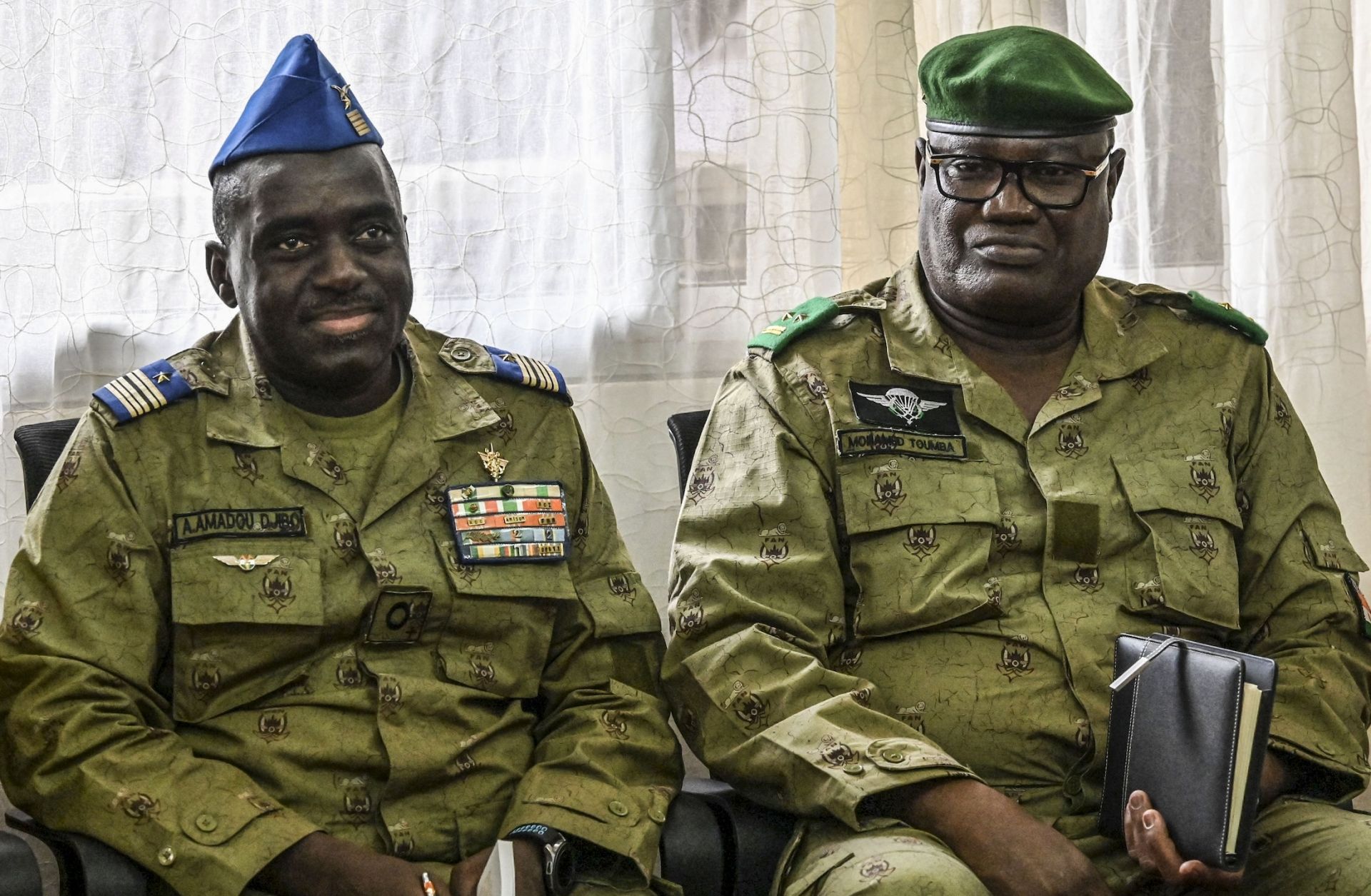 Mohamed Toumba (R), one of the generals who ousted Nigerien President Mohamed Bazoum in July 2023, and military junta spokesperson Amadou Abdramane (L) look on in Niamey, Niger, on Sept. 4, 2023. 