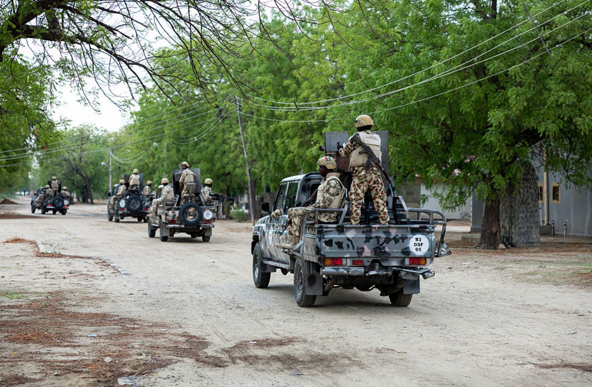 Nigerian soldiers from the Multinational Joint Task Force (MNJTF) drive in pick-ups during training at the Sector 3 MNJTF military base headquarters in Monguno, Borno state, Nigeria, on July 5, 2025. 