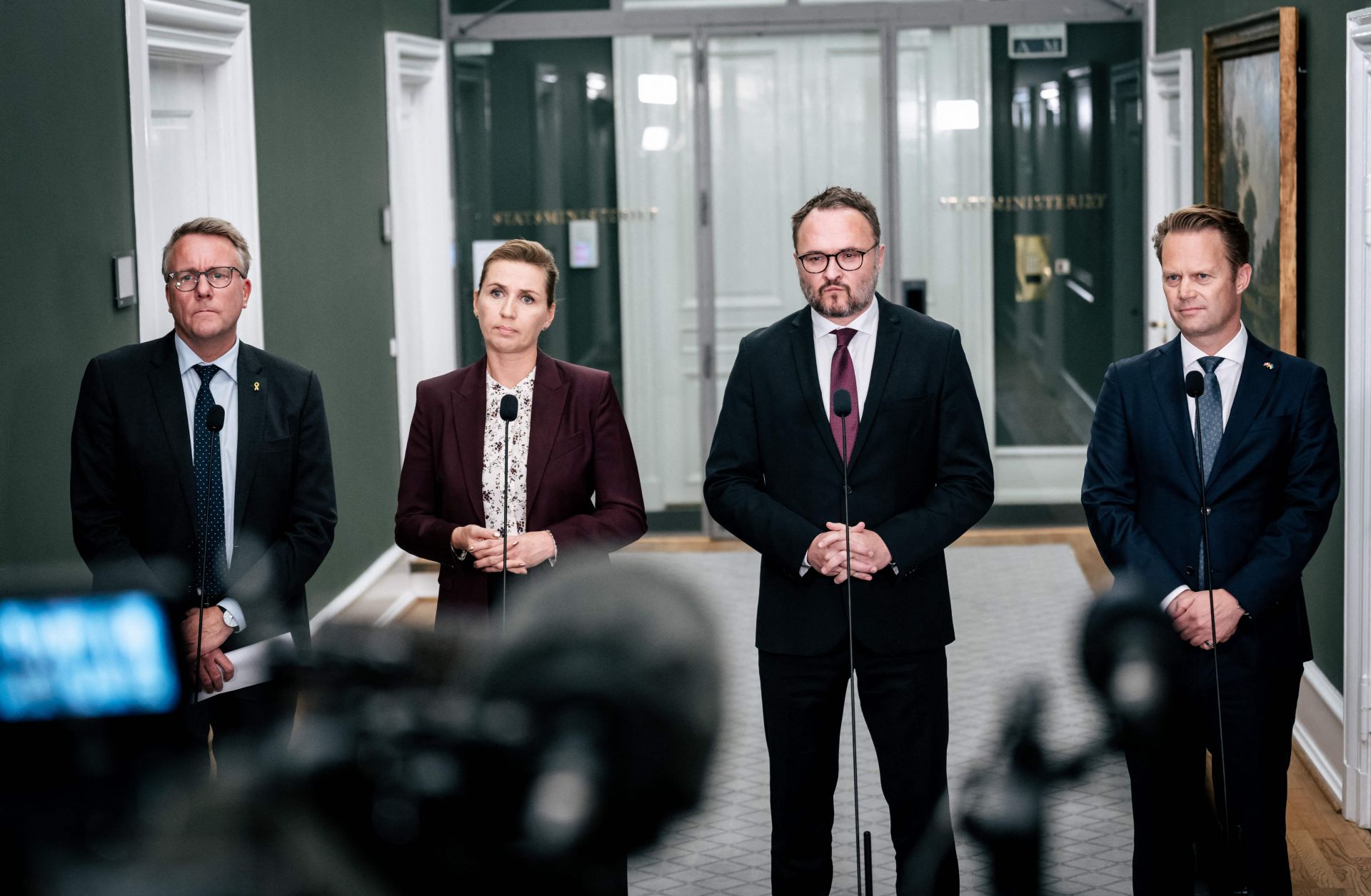 From left to right are Danish Minster of Defense Morten Bodskov, Danish Prime Minister Mette Frederiksen, Danish Climate Minister Dan Joergensen and Danish Minister of Foreign Affairs Jeppe Kofod. The ministers are speaking to the press about three gas leaks on the Nord Stream gas pipelines in the Baltic Sea at a doorstep in Copenhagen on Sept. 27.