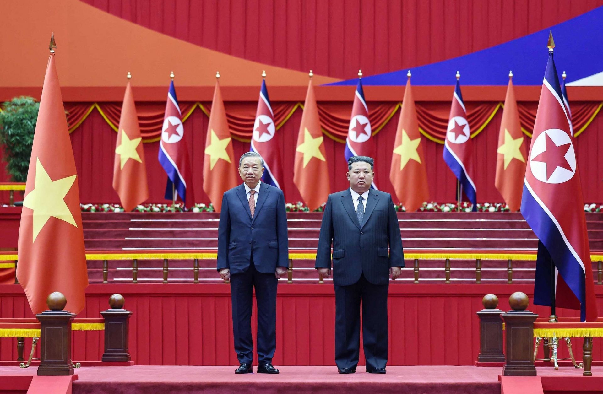 Vietnamese Communist Party General Secretary To Lam (left) and North Korean leader Kim Jong Un participate in a ceremony at the Pyongyang Sports Palace on Oct. 9, 2025, during Lam's three-day official visit to North Korea.