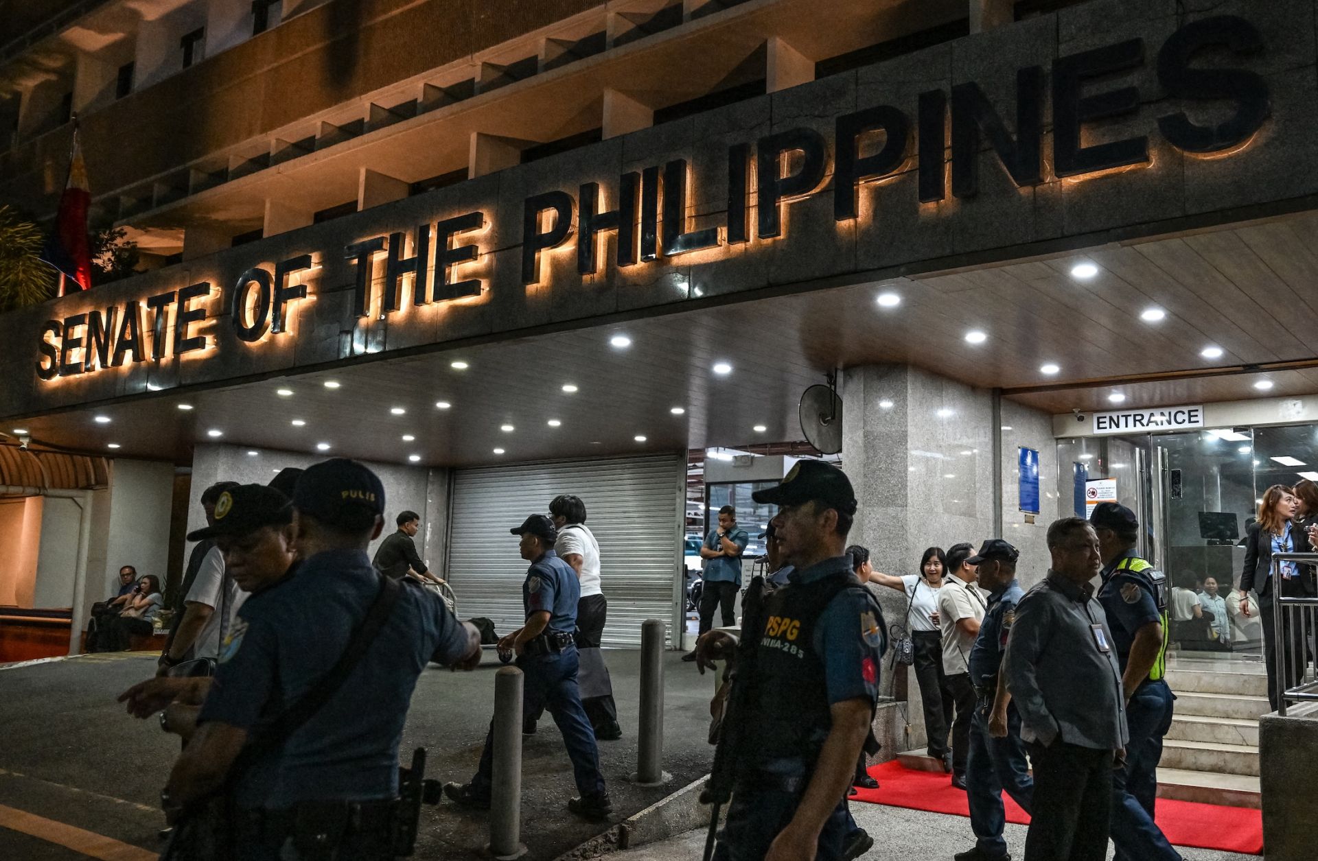 Police personnel arrive outside the Senate of the Philippines in Pasay, Metro Manila, on May 13, 2026.