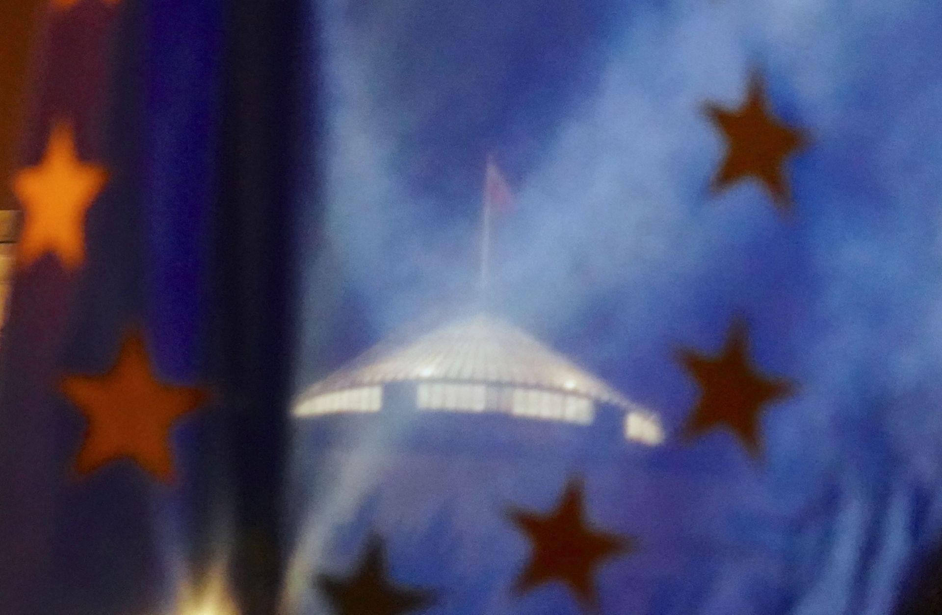 The parliament building is seen through a European flag during a demonstration against a judicial reform pushed by lawmakers of the ruling Law and Justice party on Jan. 23, 2020, in Warsaw, Poland. The parliament building is seen through a European flag during a demonstration against a judicial reform pushed by lawmakers of the ruling Law and Justice party on Jan. 23, 2020, in Warsaw, Poland.