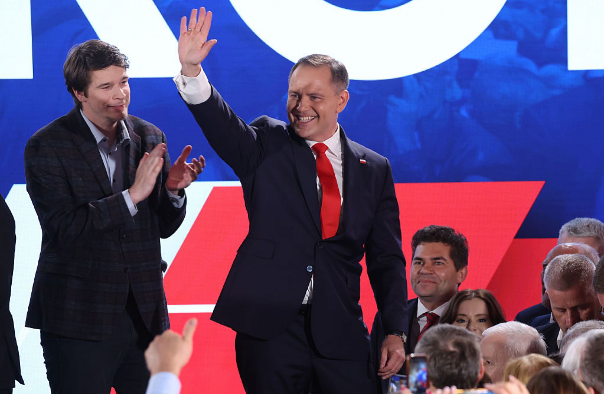 Right-wing opposition candidate Karol Nawrocki waves to supporters in Warsaw, Poland, following the presidential runoff election on June 1, 2025.