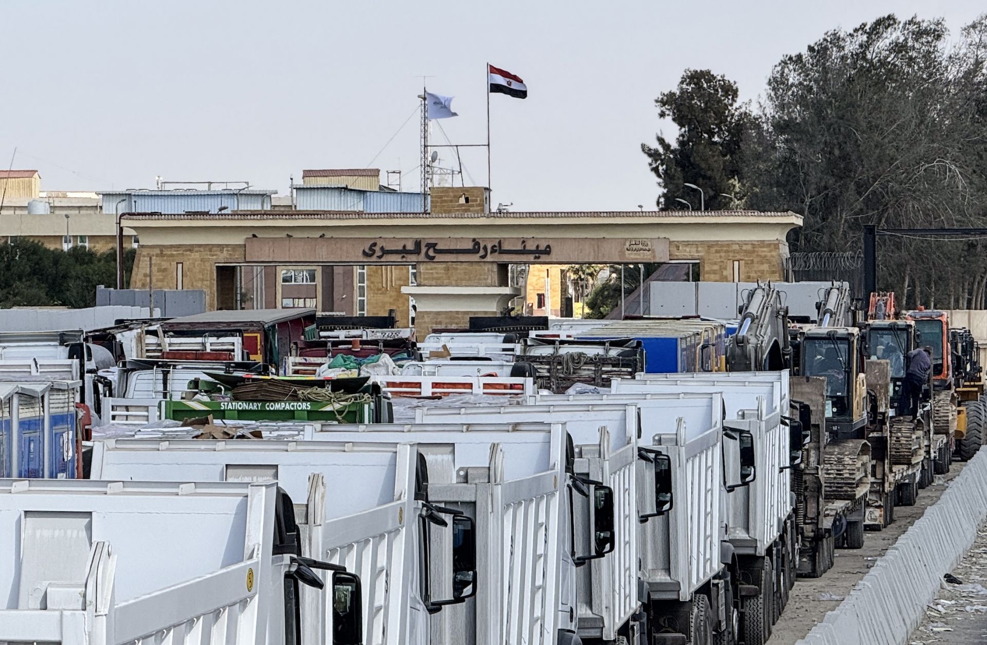 Egyptian trucks and heavy machinery on Oct. 26, 2025, on the Egyptian side of the Rafah border crossing with the Gaza Strip.