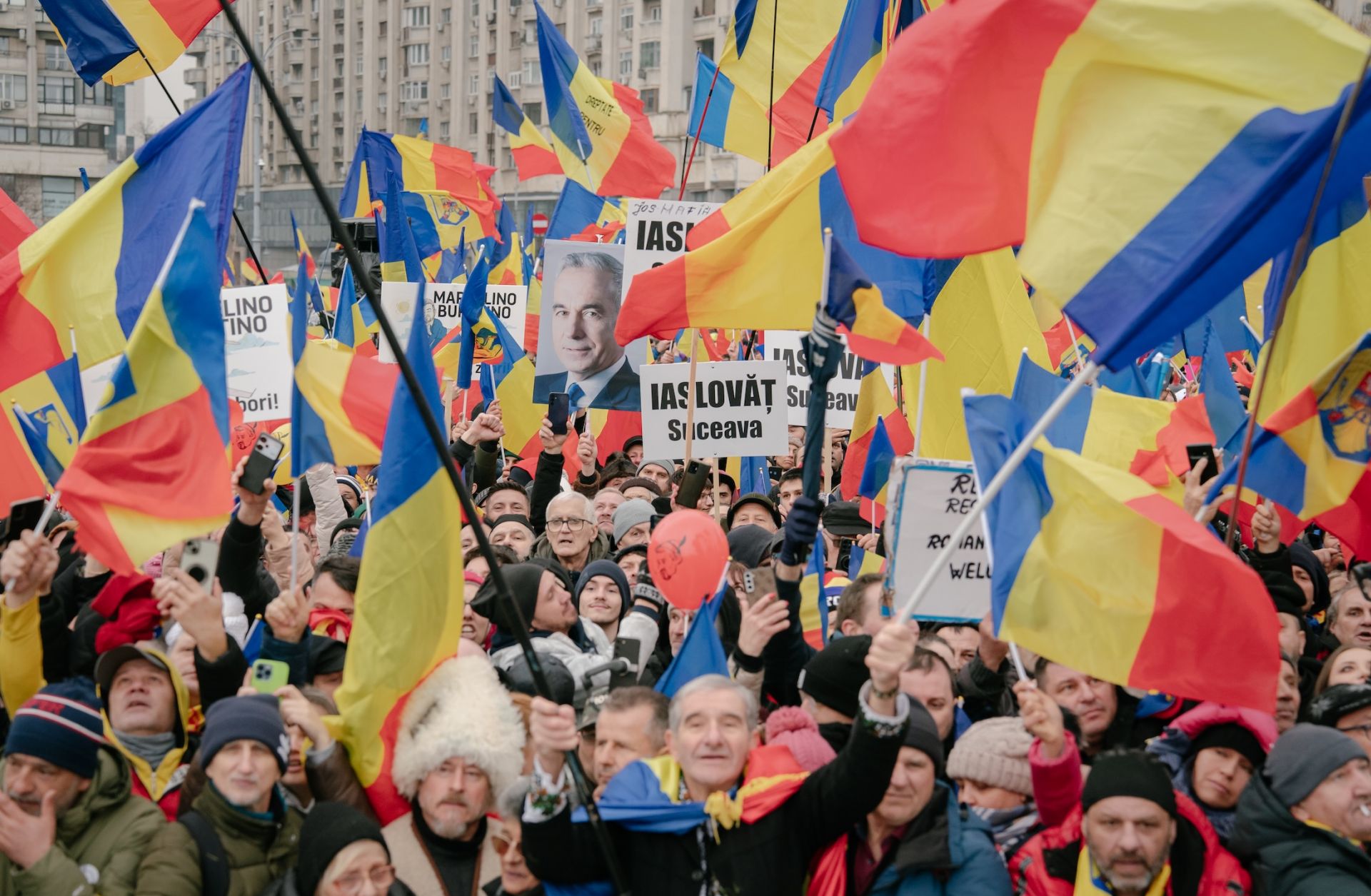 Supporters of the far-right Romanian politician Calin Georgescu take part in an anti-government protest in Bucharest on March 1, 2025. 