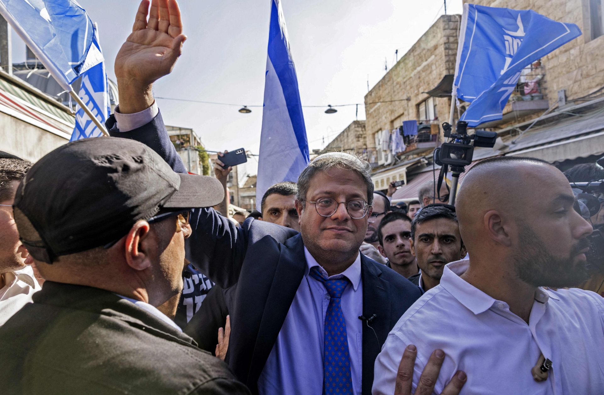 Israeli far-right lawmaker and Otzma Yehudit leader Itamar Ben-Gvir (C) greets supporters during a campaign rally Oct. 28, 2022, in Jerusalem's Mahane Yehuda Market. 