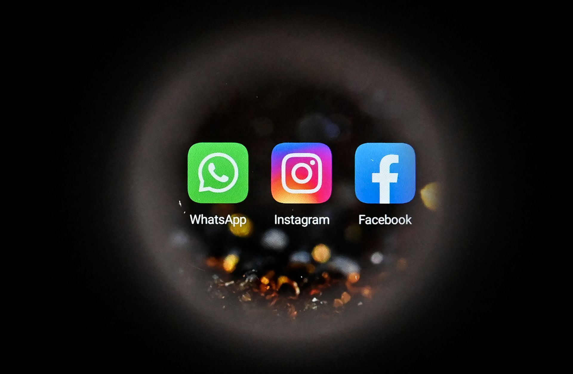 The logos of the U.S.-based social media platforms WhatsApp, Instagram and Facebook (left to right) are seen on a smartphone screen in Moscow, Russia, on Oct. 5, 2021. 
