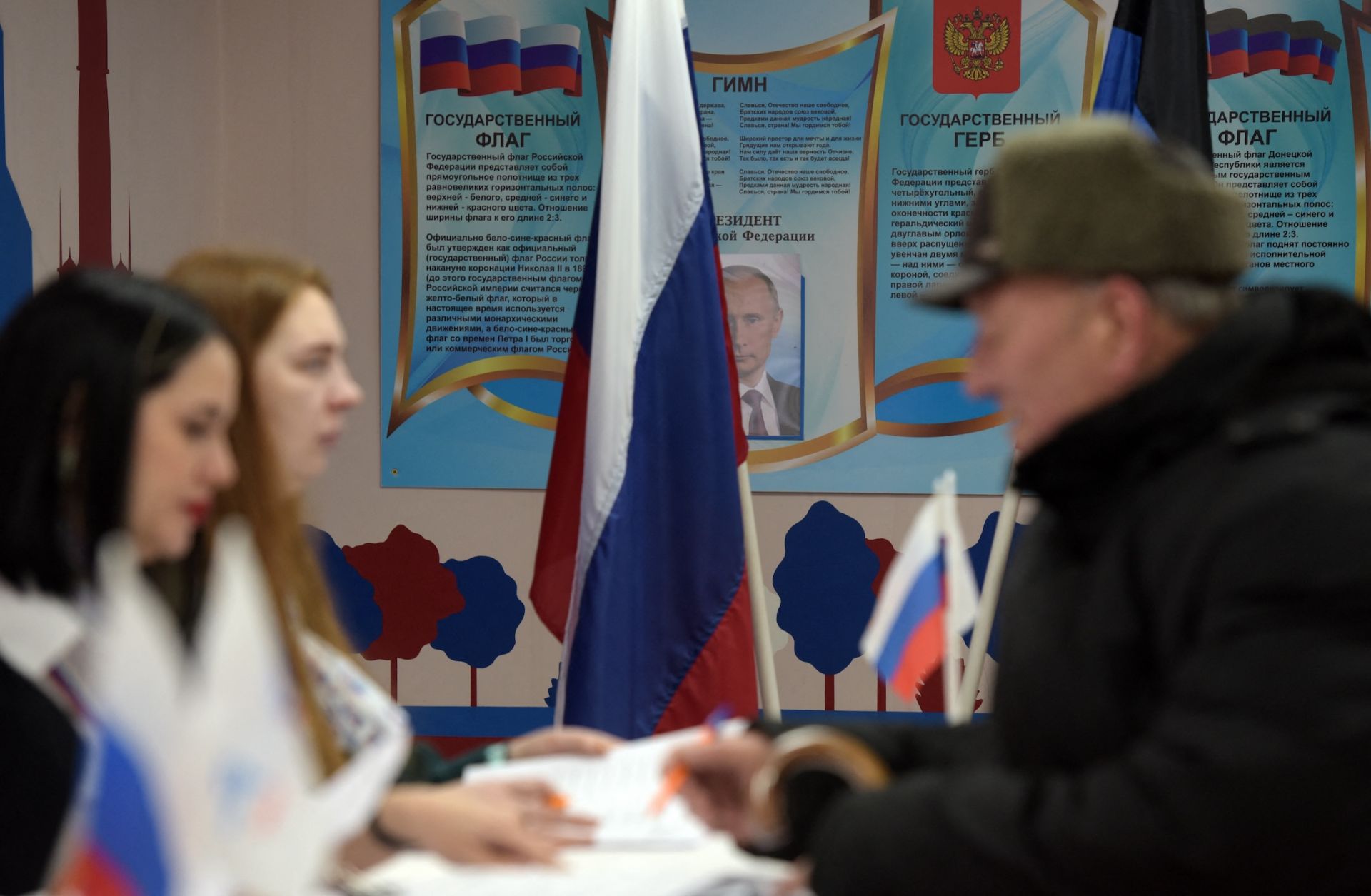 People vote in Russia's presidential election in the Russian-controlled area of the Donetsk region of Ukraine on March 15, 2024. 