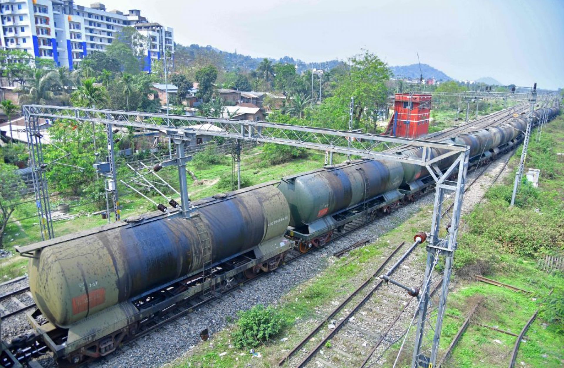 An oil tanker train passes near a refinery in Guwahati, India, on March 30, 2023. An oil tanker train passes near a refinery in Guwahati, India, on March 30, 2023.