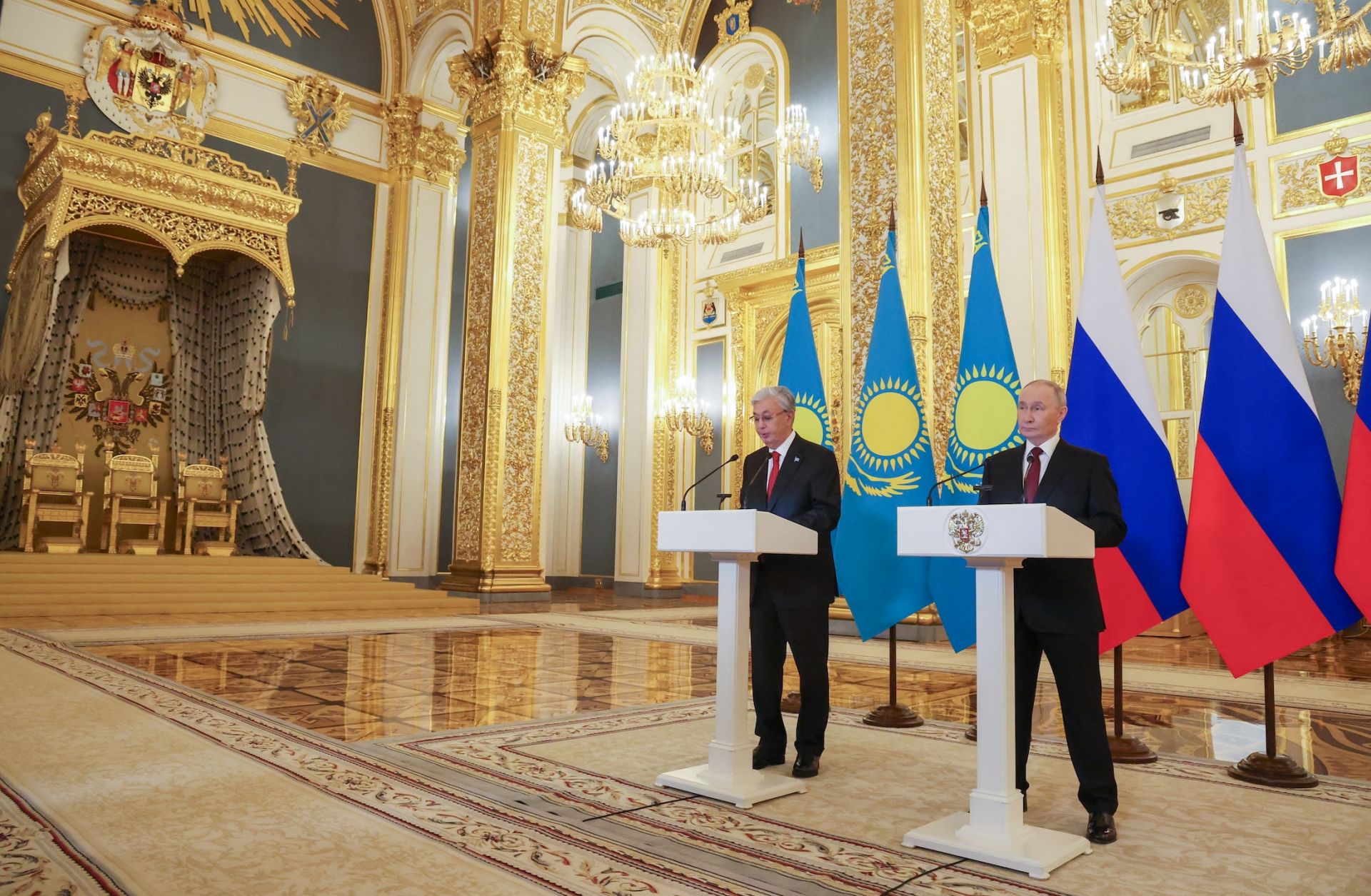 Russian President Vladimir Putin and Kazakh President Kassym-Jomart Tokayev address participants of the 21st Russia-Kazakhstan Interregional Cooperation Forum via a video link during their talks at the Kremlin in Moscow on Nov. 12, 2025. 