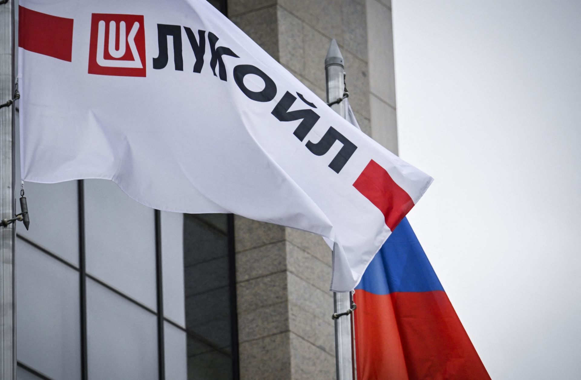 A flag displaying the logo for Russia's Lukoil oil giant flies near a Russian flag in Moscow on Oct. 23, 2025. A flag displaying the logo for Russia's Lukoil oil giant flies near a Russian flag in Moscow on Oct. 23, 2025.