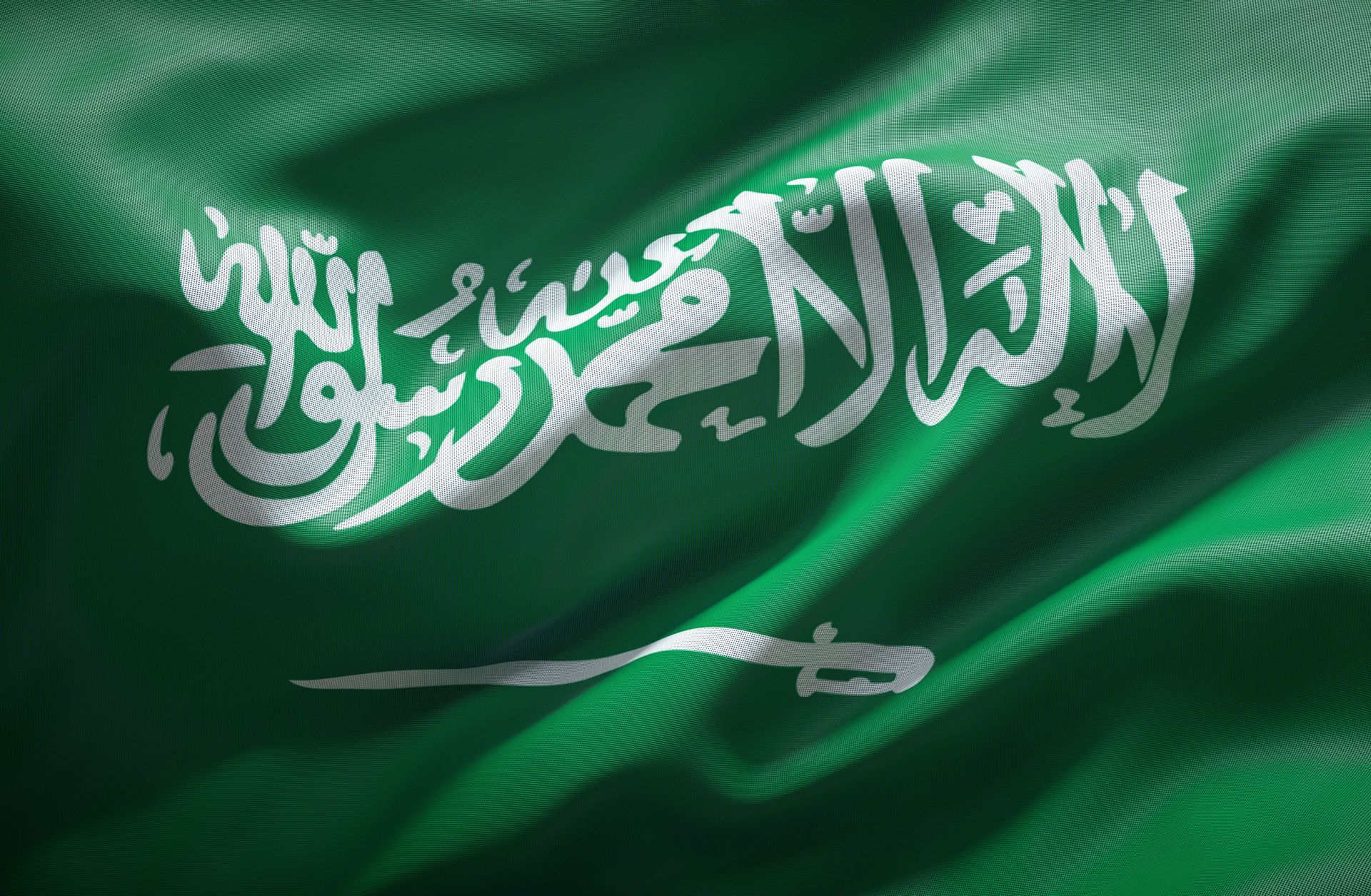 An image shows the national flag of Saudi Arabia.