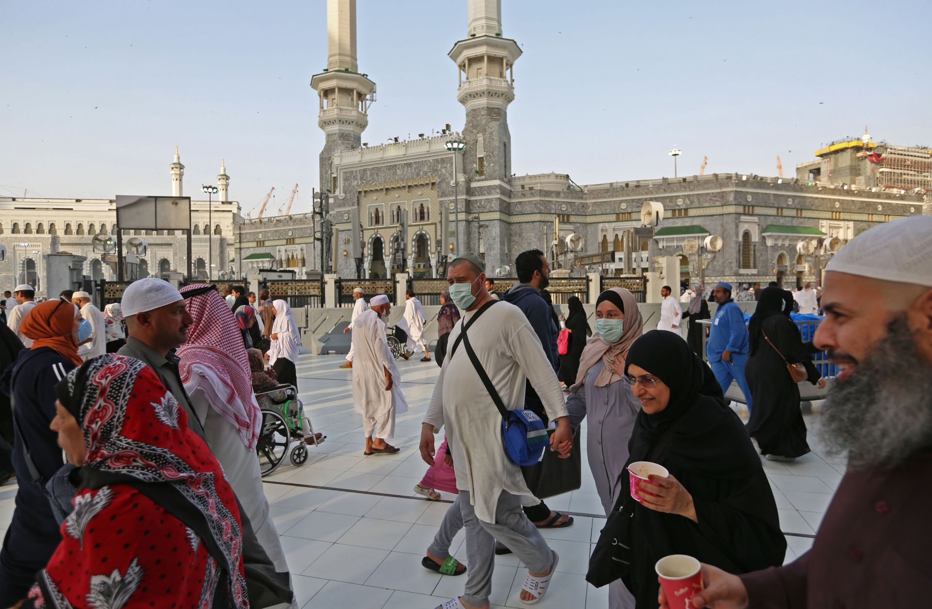 Muslim pilgrims wear masks at the Grand Mosque in Saudi Arabia's holy city of Mecca on Feb. 28, 2020. 
