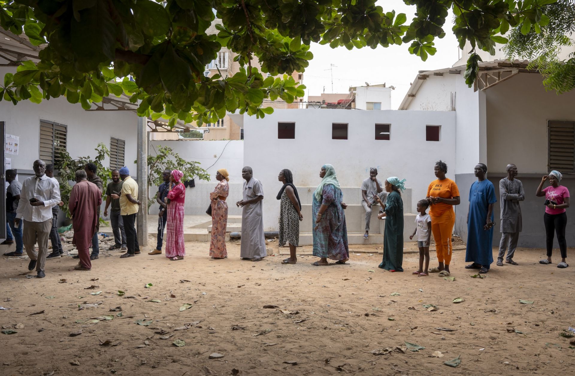 Voters wait in line outside a voting station in Dakar on Nov. 17, 2024, during Senegal's parliamentary elections.