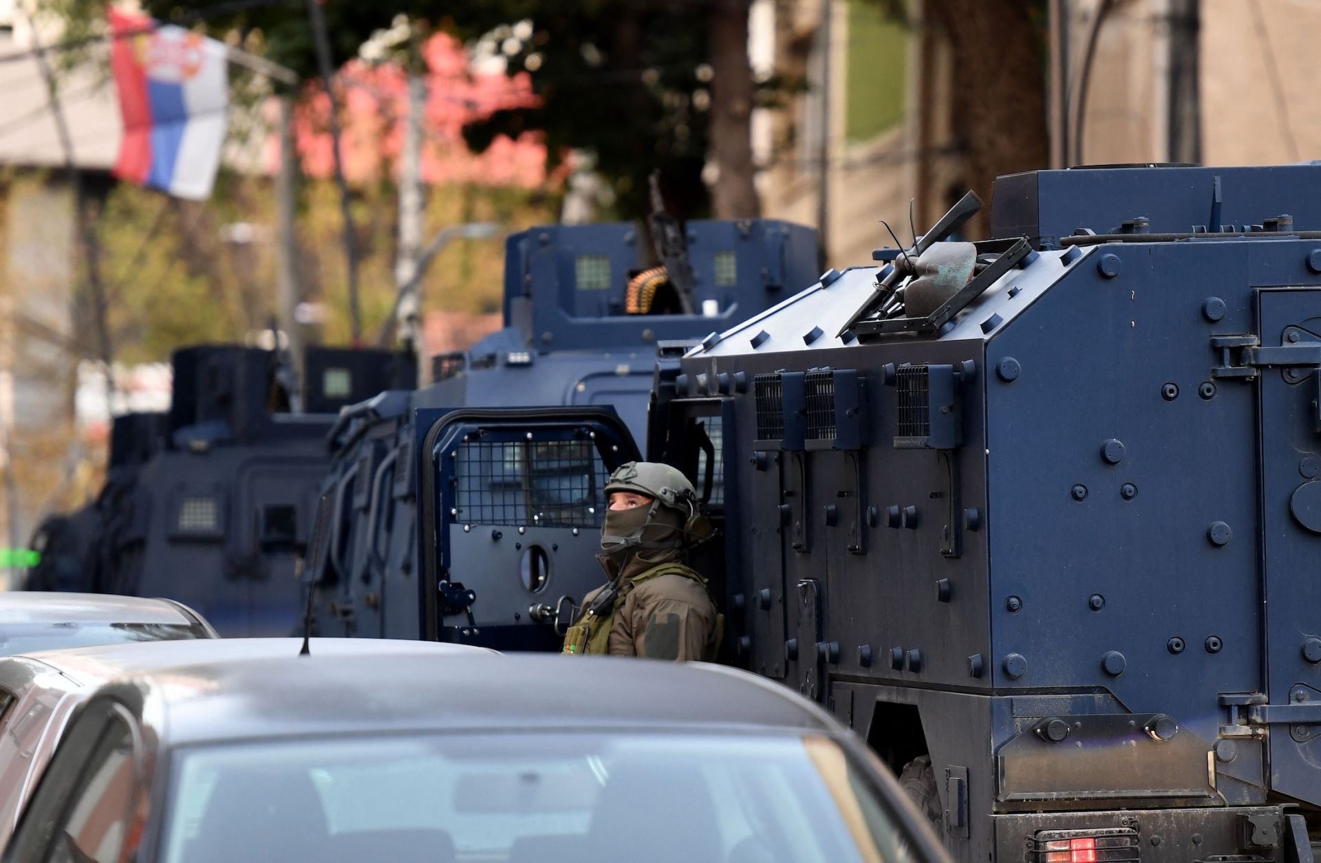 Authorities search a building in Mitrovica, northern Kosovo, on Sept. 29, 2023, after the killing of a police officer.