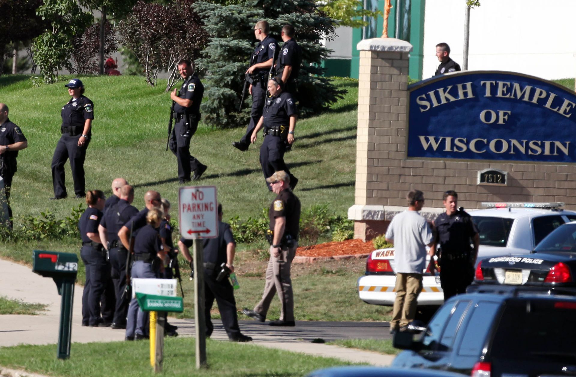 Law enforcement personnel outside the Sikh Temple of Wisconsin after a gunman fired upon people at a service there on Aug. 5, 2012, in Oak Creek, Wisconsin.