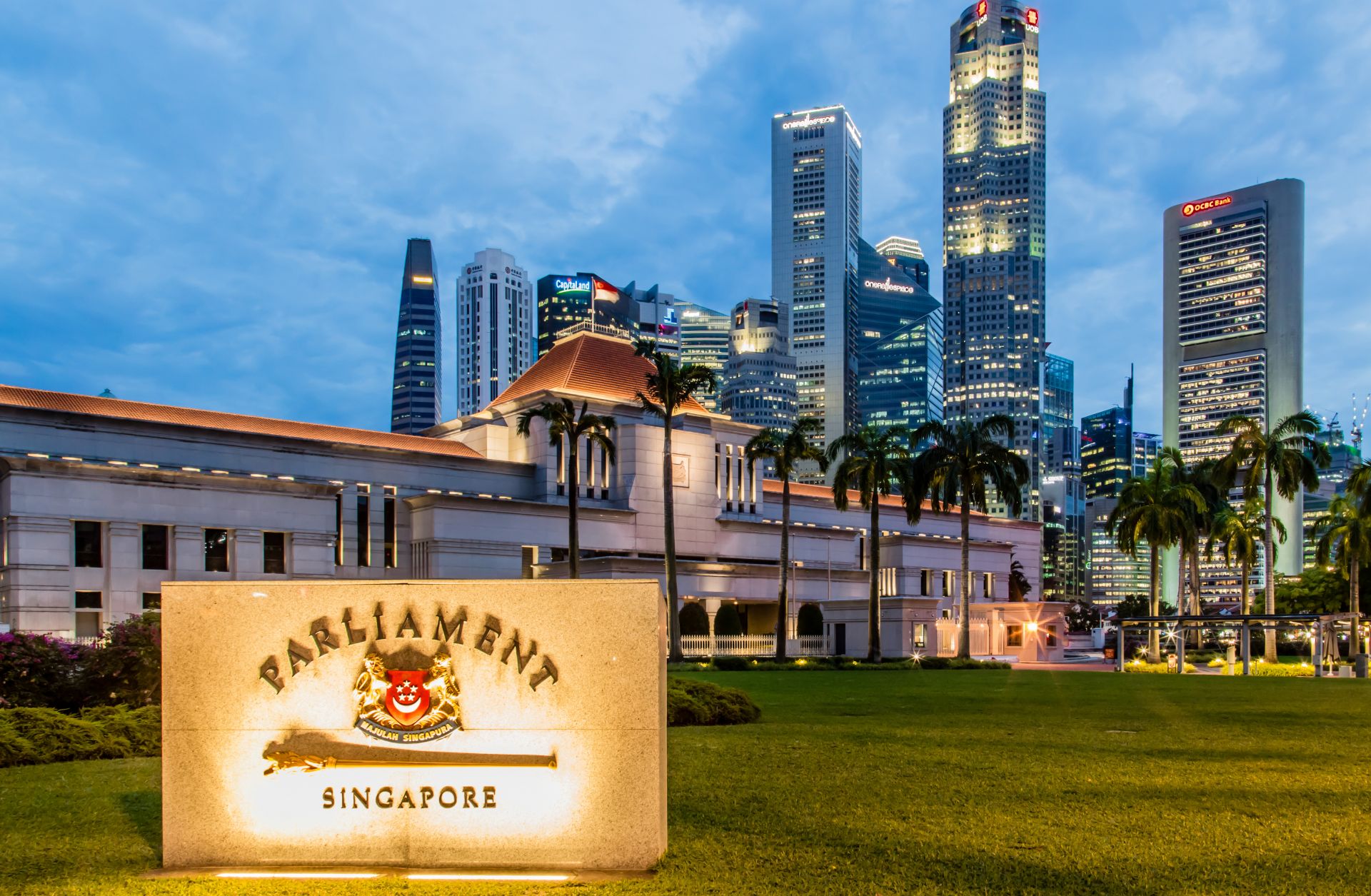A photo of Singapore's Parliament building against a cityscape.
