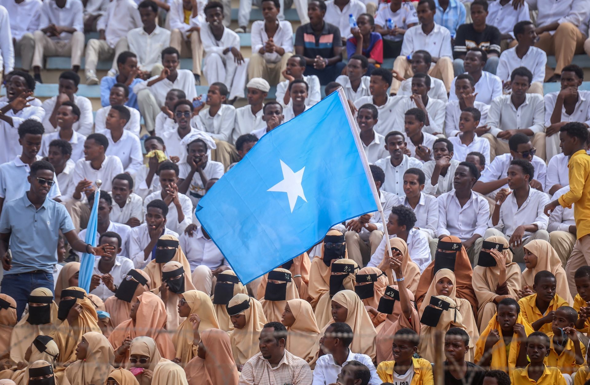 Residents wave Somali flags as they attend a rally denouncing Israel's recognition of the breakaway region of Somaliland at Mogadishu Stadium in Mogadishu, Somalia, on Dec. 30, 2025. 