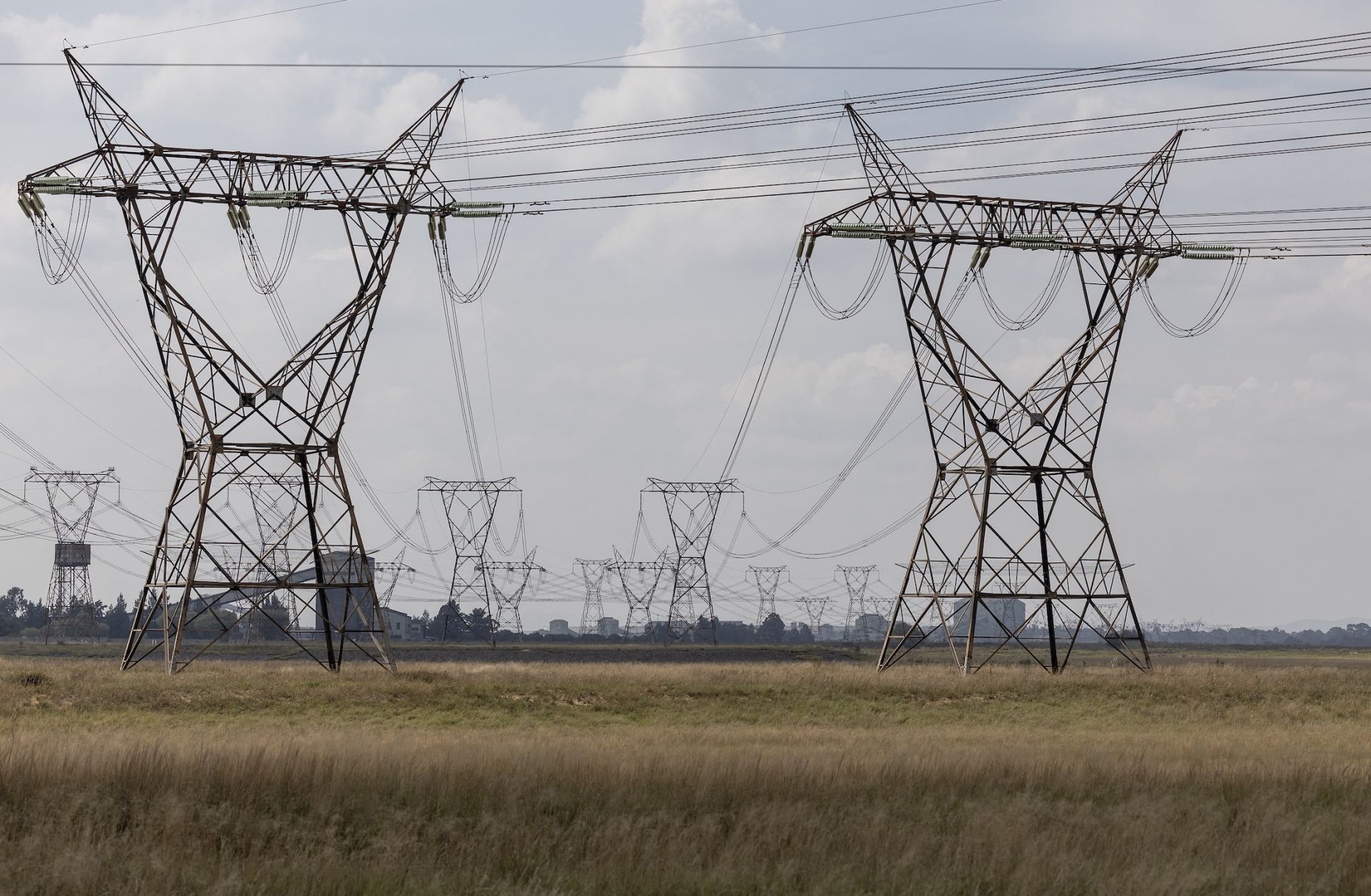 A general view of power lines near the Lethabo power station between Vereeniging and Sasolburg, South Africa, on April 17, 2024. A general view of power lines near the Lethabo power station between Vereeniging and Sasolburg, South Africa, on April 17, 2024.