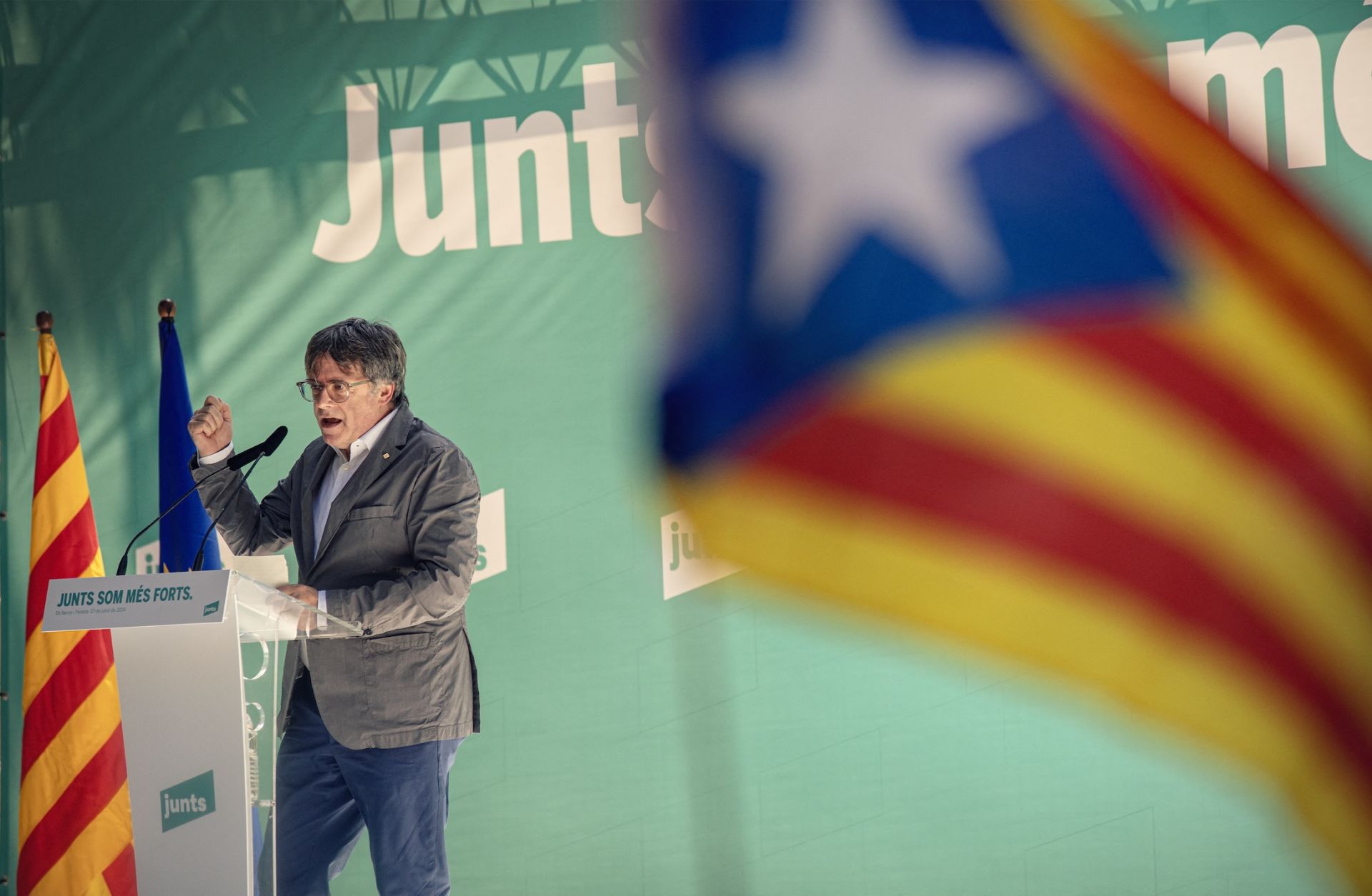 Carles Puigdemont, leader of Catalonia's pro-independence Junts party, delivers a speech in southwestern France on July 27, 2024, during a meeting held to celebrate the fourth anniversary of the party's founding.  Carles Puigdemont, leader of Catalonia's pro-independence Junts party, delivers a speech in southwestern France on July 27, 2024, during a meeting held to celebrate the fourth anniversary of the party's founding.