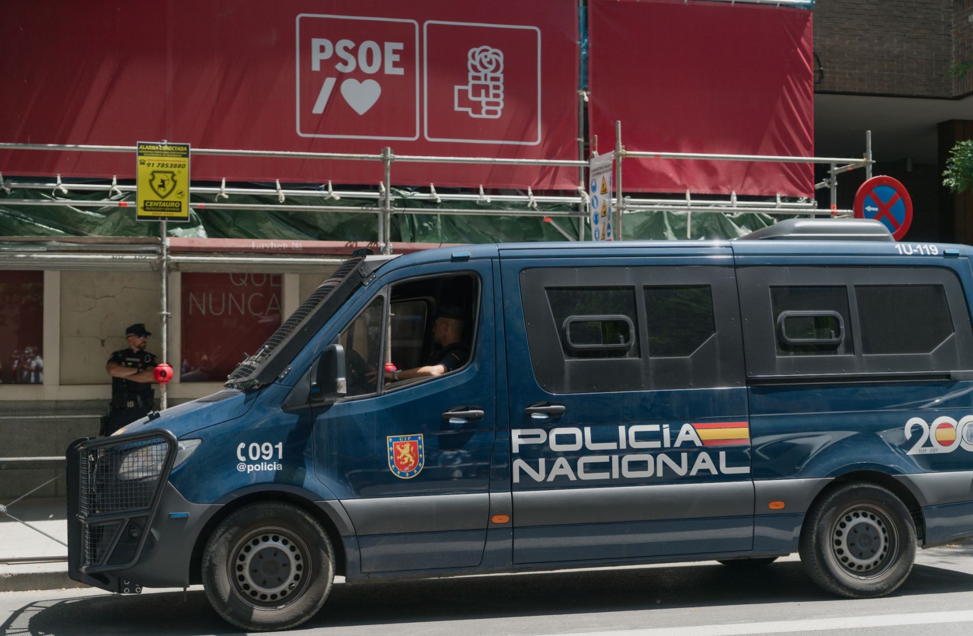 A National Police van is parked in front of the Spanish Socialist Workers' Party headquarters during the Civil Guard's police search on May 27, 2026, in Madrid, Spain. 