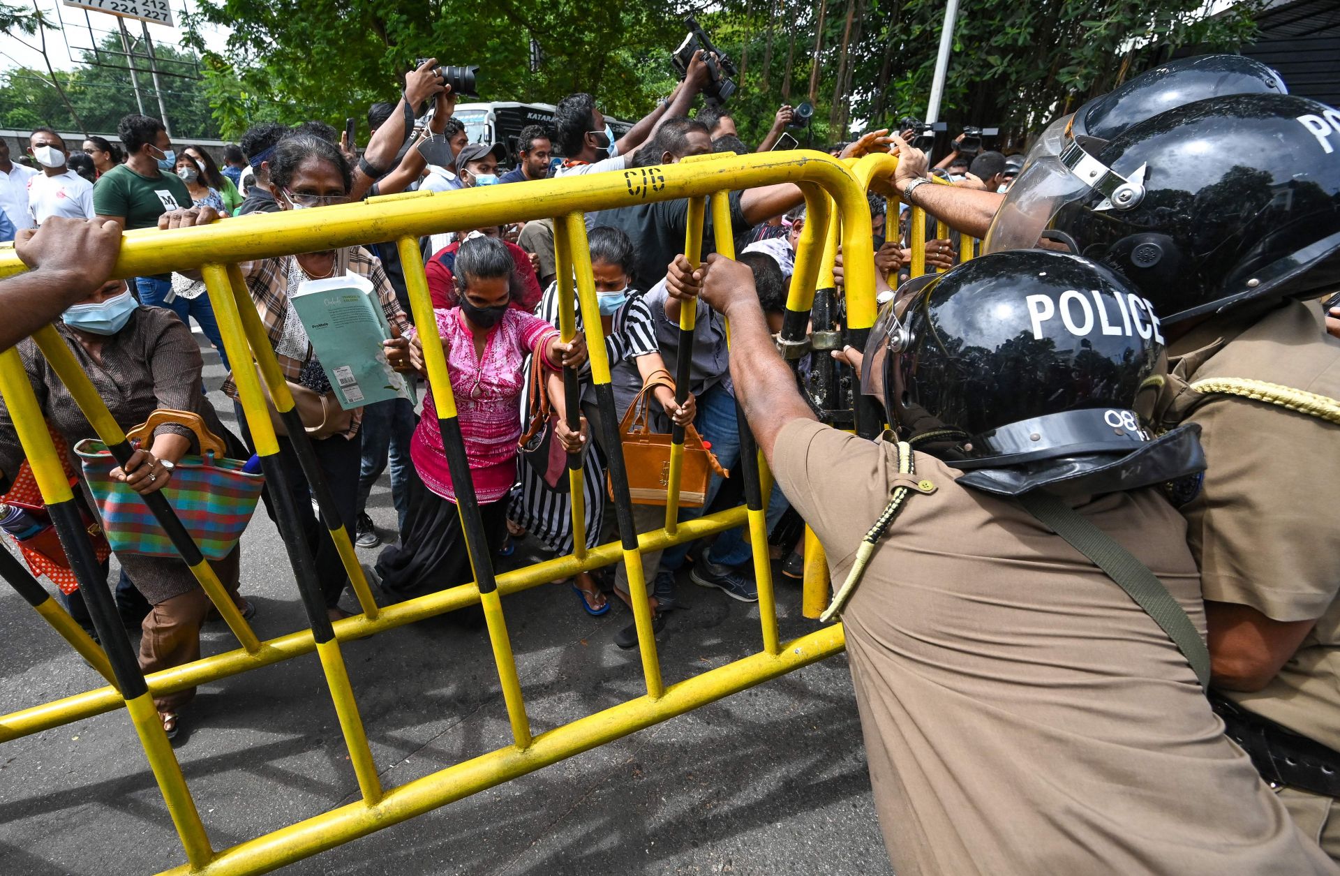 Opposition activists outside Sri Lankan Prime Minister Ranil Wickremesinghe's private residence on June 22, 2022, in Colombo, Sri Lanka.