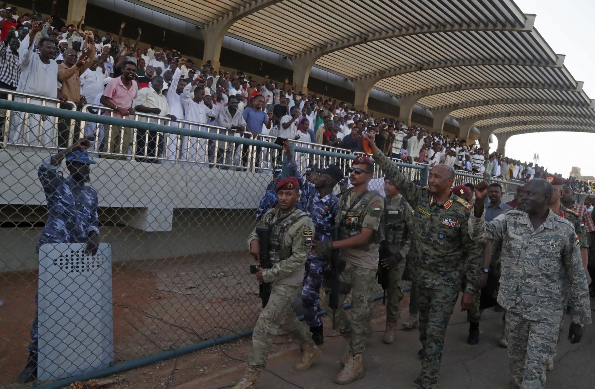 Sudan's de facto leader and army chief, Abdel Fattah al-Burhan, waves to spectators after attending a soccer match at Kober Stadium in Khartoum on May 15, 2026.