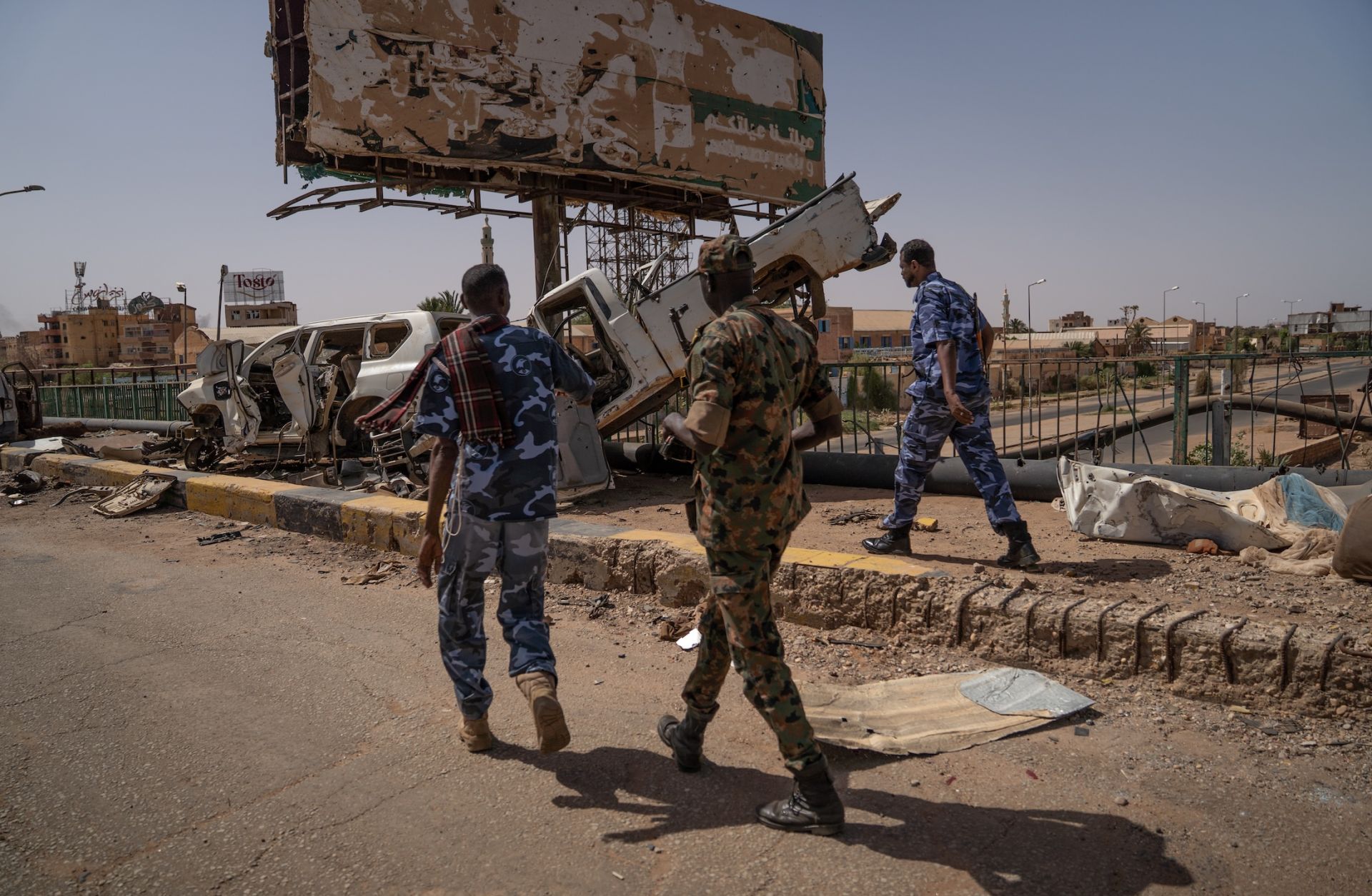 Sudanese Armed Forces soldiers are seen on the now-disabled Shambat Bridge in Khartoum. 
