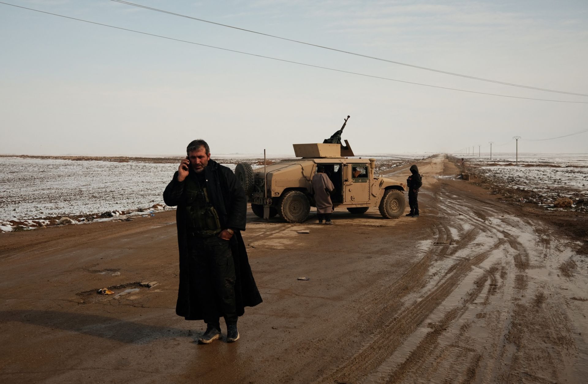 A fighter of the Syrian Democratic Forces stands on a road between the Syrian villages of Safa and Tell Brak on Jan. 24, 2026. A fighter of the Syrian Democratic Forces stands on a road between the Syrian villages of Safa and Tell Brak on Jan. 24, 2026.