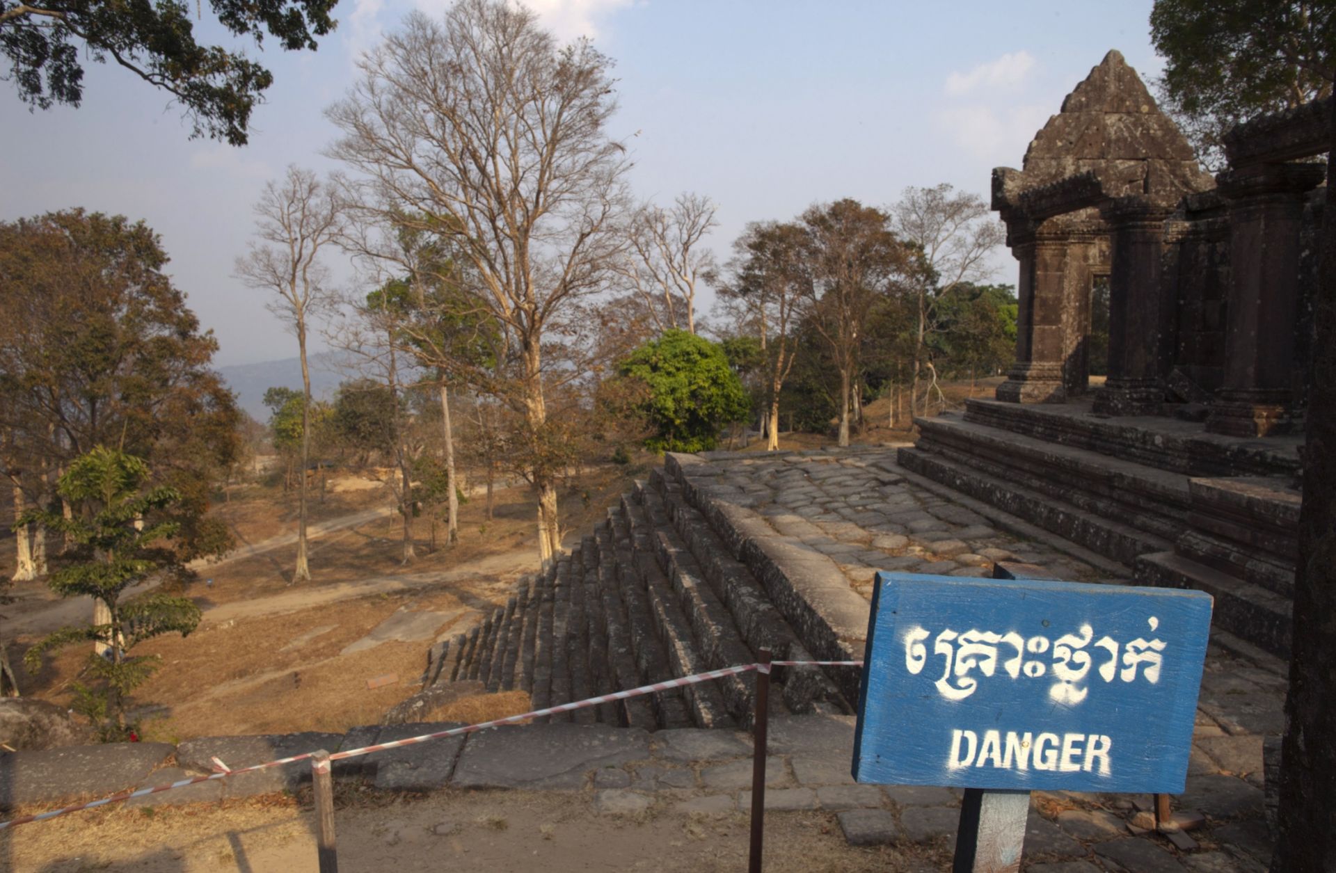 A ''Danger'' sign warns visitors about a fragile structure within the grounds of the Preah Vihear temple in Cambodia.