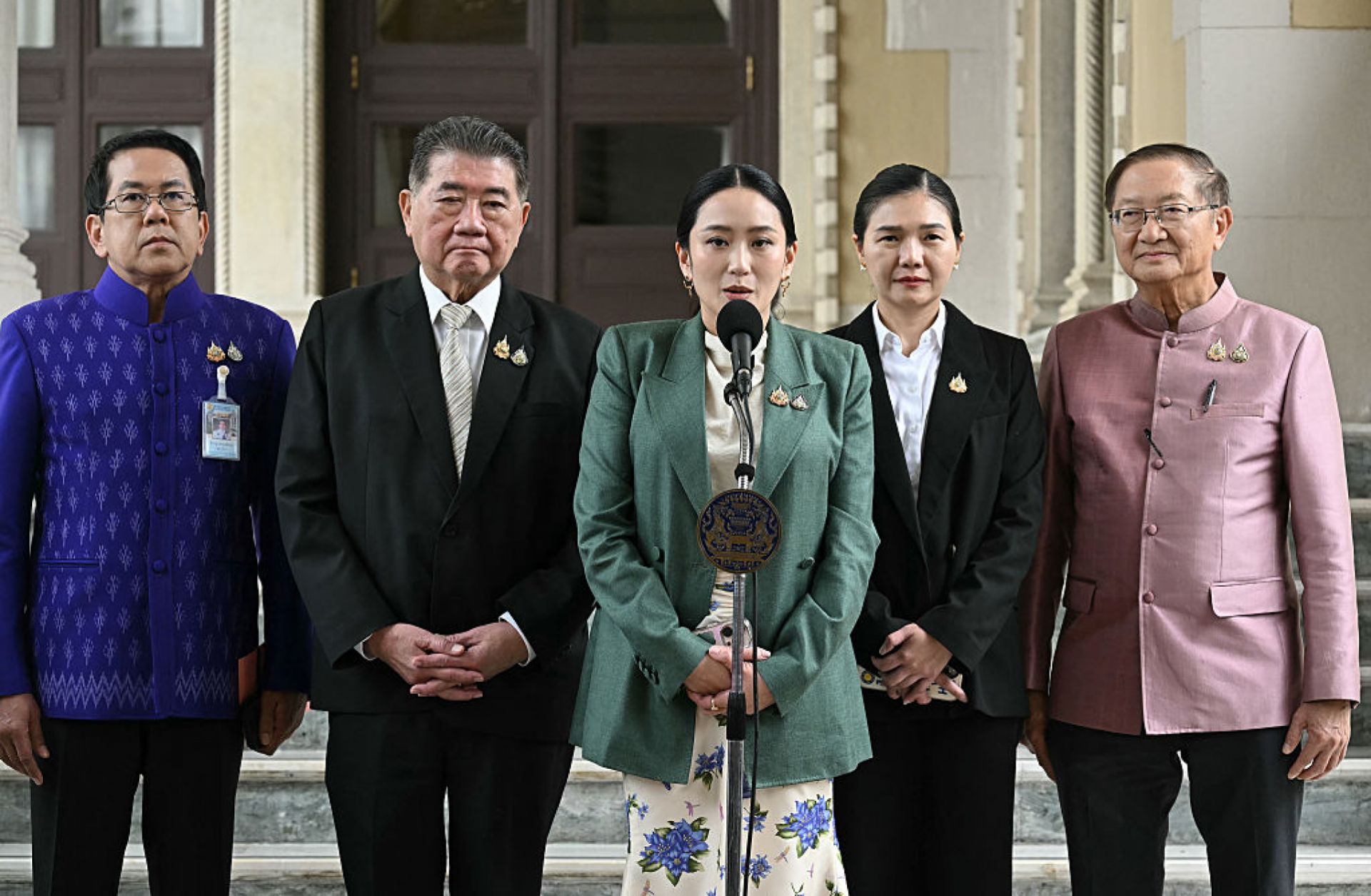 Thai Prime Minister Paetongtarn Shinawatra (center) speaks next to Deputy Prime Minister Phumtham Wechayachai (2nd from left) during a press conference in Bangkok following her suspension by the country's Constitutional Court on July 1, 2025. Thai Prime Minister Paetongtarn Shinawatra (center) speaks next to Deputy Prime Minister Phumtham Wechayachai (2nd from left) during a press conference in Bangkok following her suspension by the country's Constitutional Court on July 1, 2025.