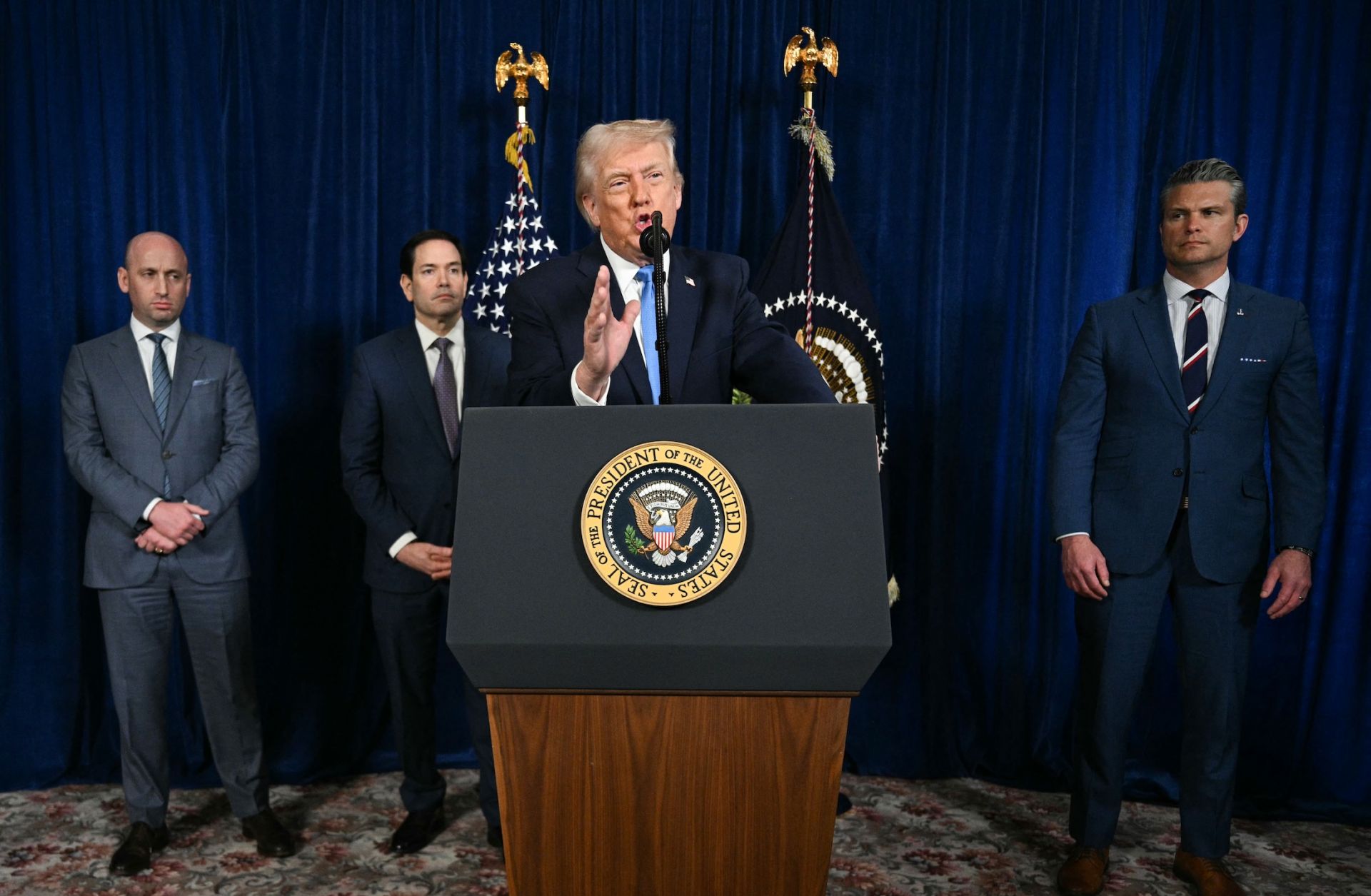 U.S. President Donald Trump, alongside (left to right) Deputy Chief of Staff Stephen Miller, Secretary of State Marco Rubio and Secretary of Defense Pete Hegseth, speaks to the press following U.S. military actions in Venezuela, at his Mar-a-Lago residence in Palm Beach, Florida, on Jan. 3, 2026.