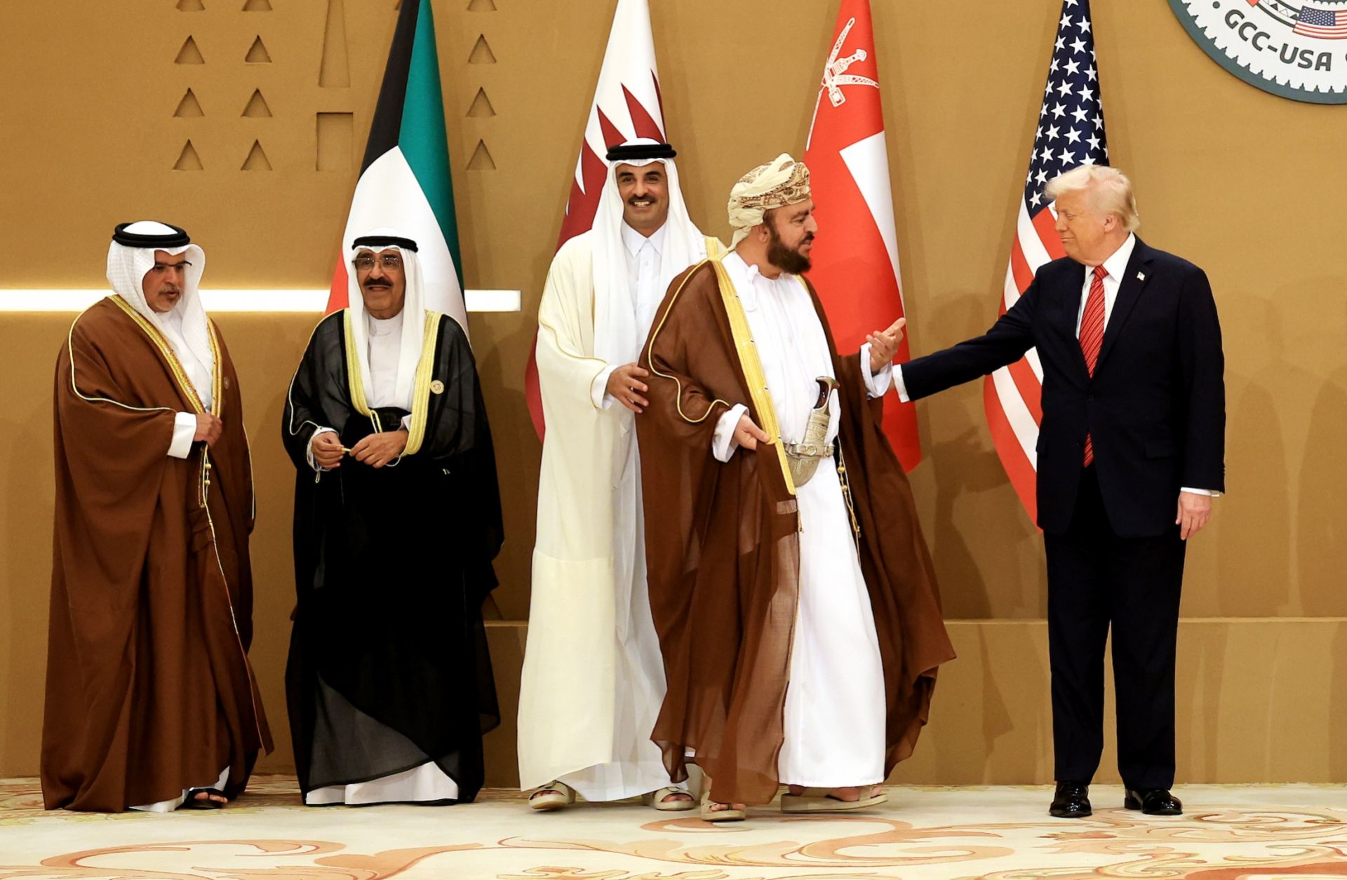 U.S. President Donald Trump (right) interacts with Oman Deputy Prime Minister Sayyid Asaad (second from right) as they prepare to pose for photos with leaders during the Gulf Cooperation Council (GCC) Leaders' Summit in Riyadh, Saudi Arabia, on May 14, 2025. U.S. President Donald Trump (right) interacts with Oman Deputy Prime Minister Sayyid Asaad (second from right) as they prepare to pose for photos with leaders during the Gulf Cooperation Council (GCC) Leaders' Summit in Riyadh, Saudi Arabia, on May 14, 2025.