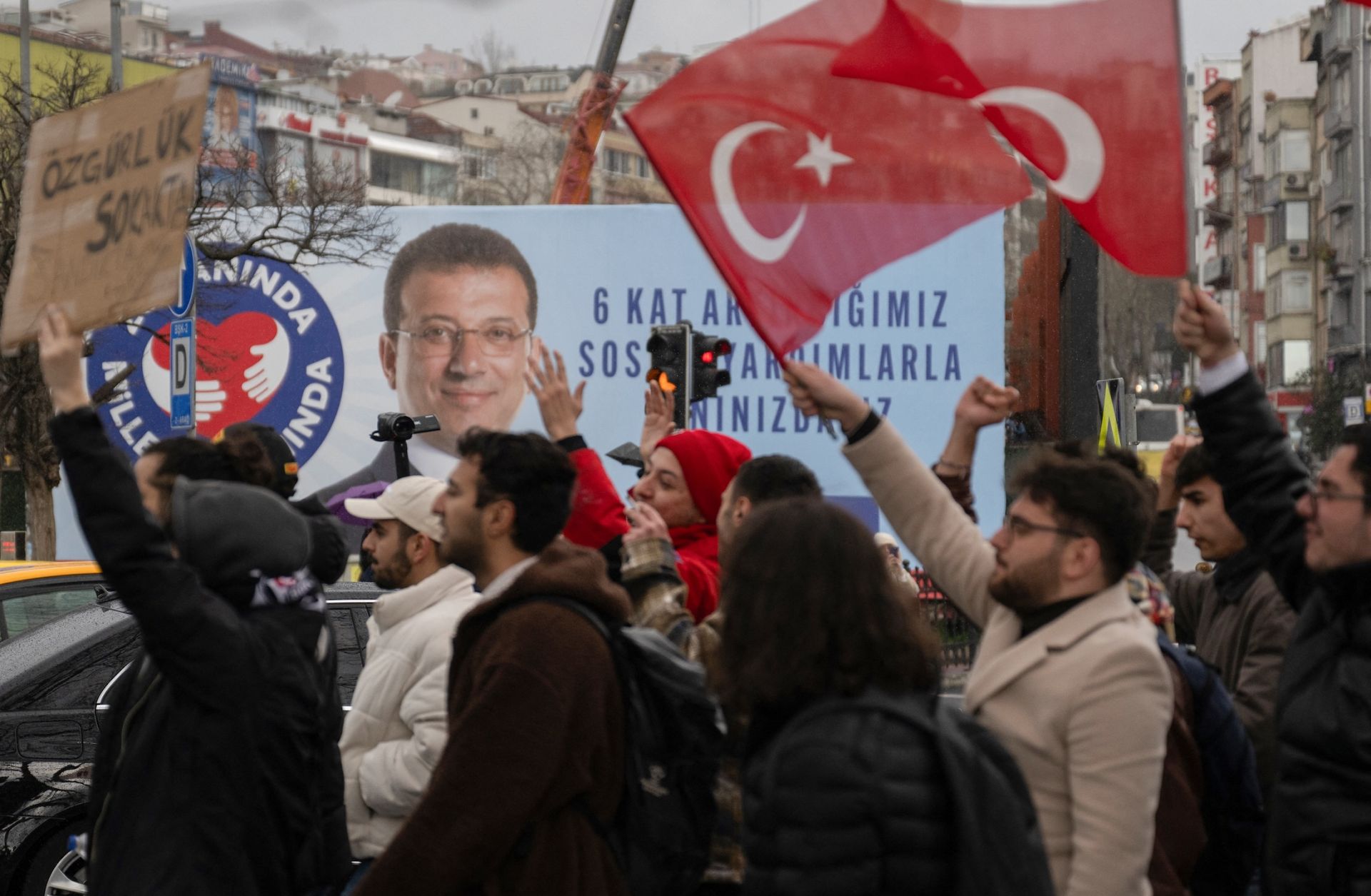 People wave Turkish national flags as they protest in Istanbul on March 20, 2025, following Mayor Ekrem Imamoglu's detention over a corruption probe.