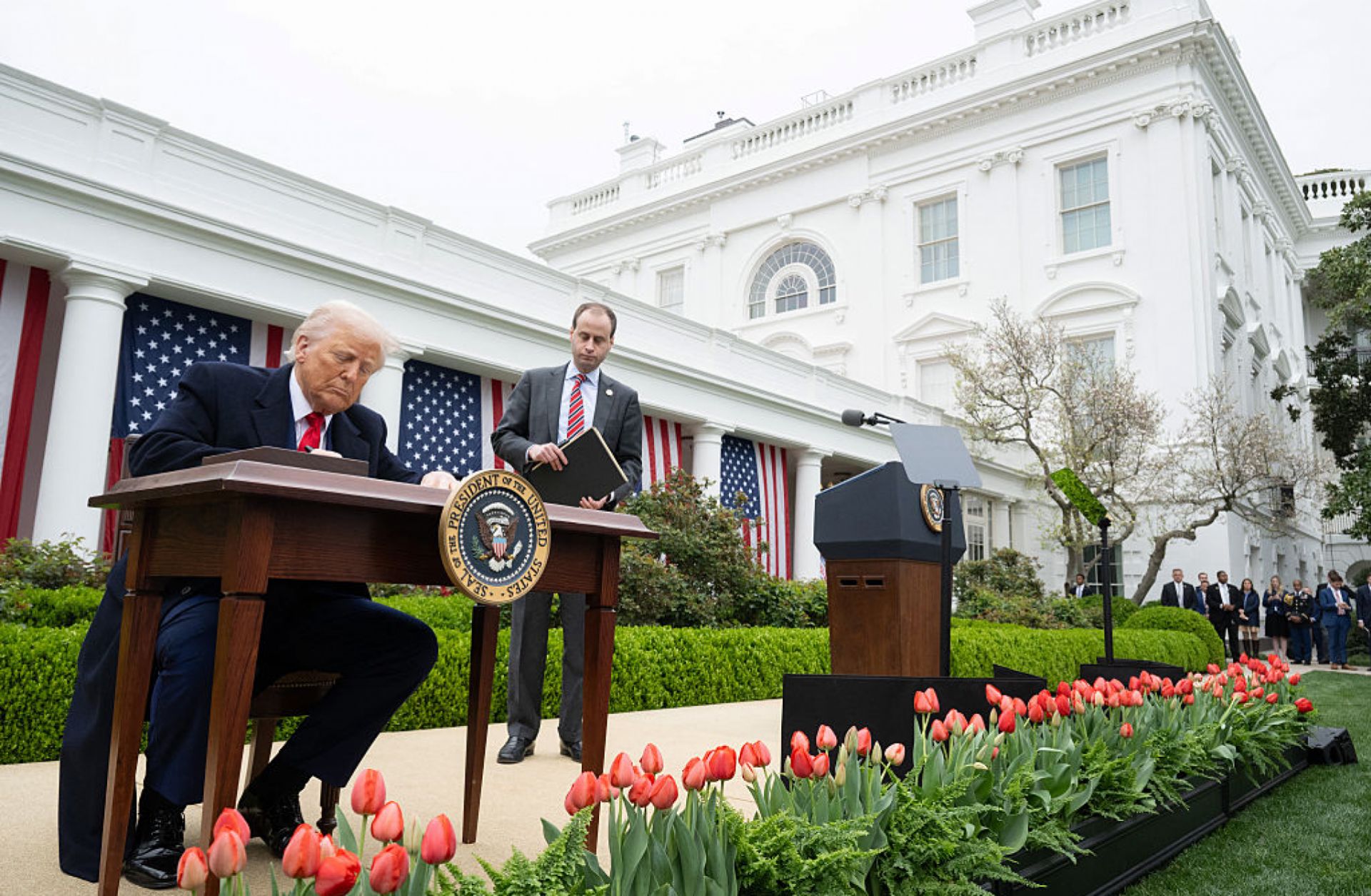 U.S. President Donald Trump signs an executive order after delivering remarks on reciprocal tariffs during an April 2 event in the Rose Garden in Washington.