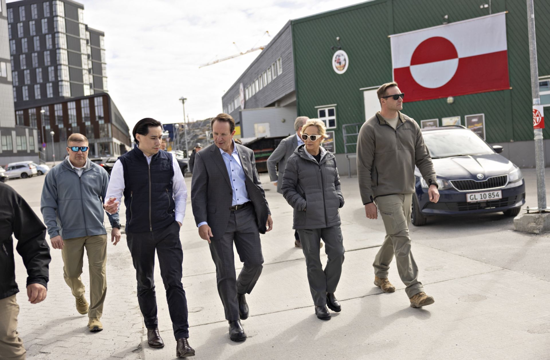 U.S. special envoy to Greenland, Republican Louisiana Governor Jeff Landry (center right), and Greenlandic mason and Trump supporter Jorgen Boassen (center left) are pictured in Nuuk, Greenland, on May 20, 2026, on the sidelines of the Future Greenland business fair. 